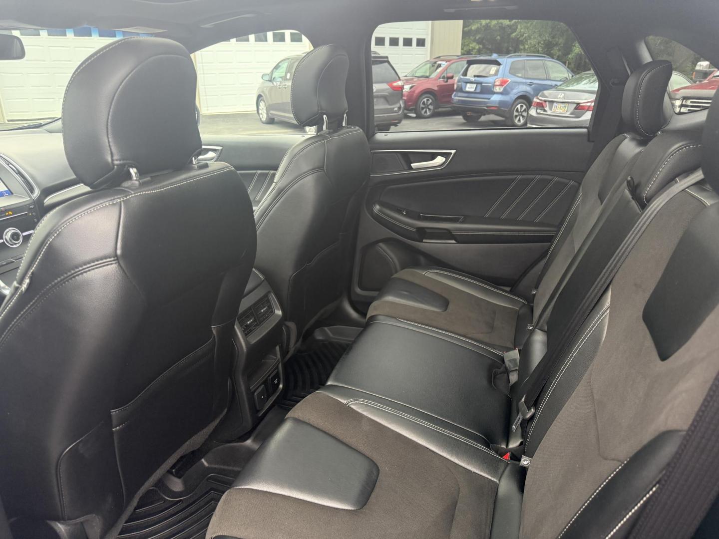 2019 Black /Black Ford Edge ST AWD (2FMPK4AP7KB) with an 2.7L V6 DOCH 24V Twin Turbo engine, 8-Speed Automatic transmission, located at 547 E. Main St., Orwell, OH, 44076, (440) 437-5893, 41.535435, -80.847855 - This 2019 Ford Edge ST AWD is a sporty midsize SUV featuring a 2.7L twin-turbo EcoBoost V6 engine paired with a 8-speed automatic transmission, delivering a robust 0-60 mph time of 5.7 seconds. Inside, it boasts leather and suede heated power front seats, a 12-speaker B&O sound system, an 8-inch tou - Photo#29