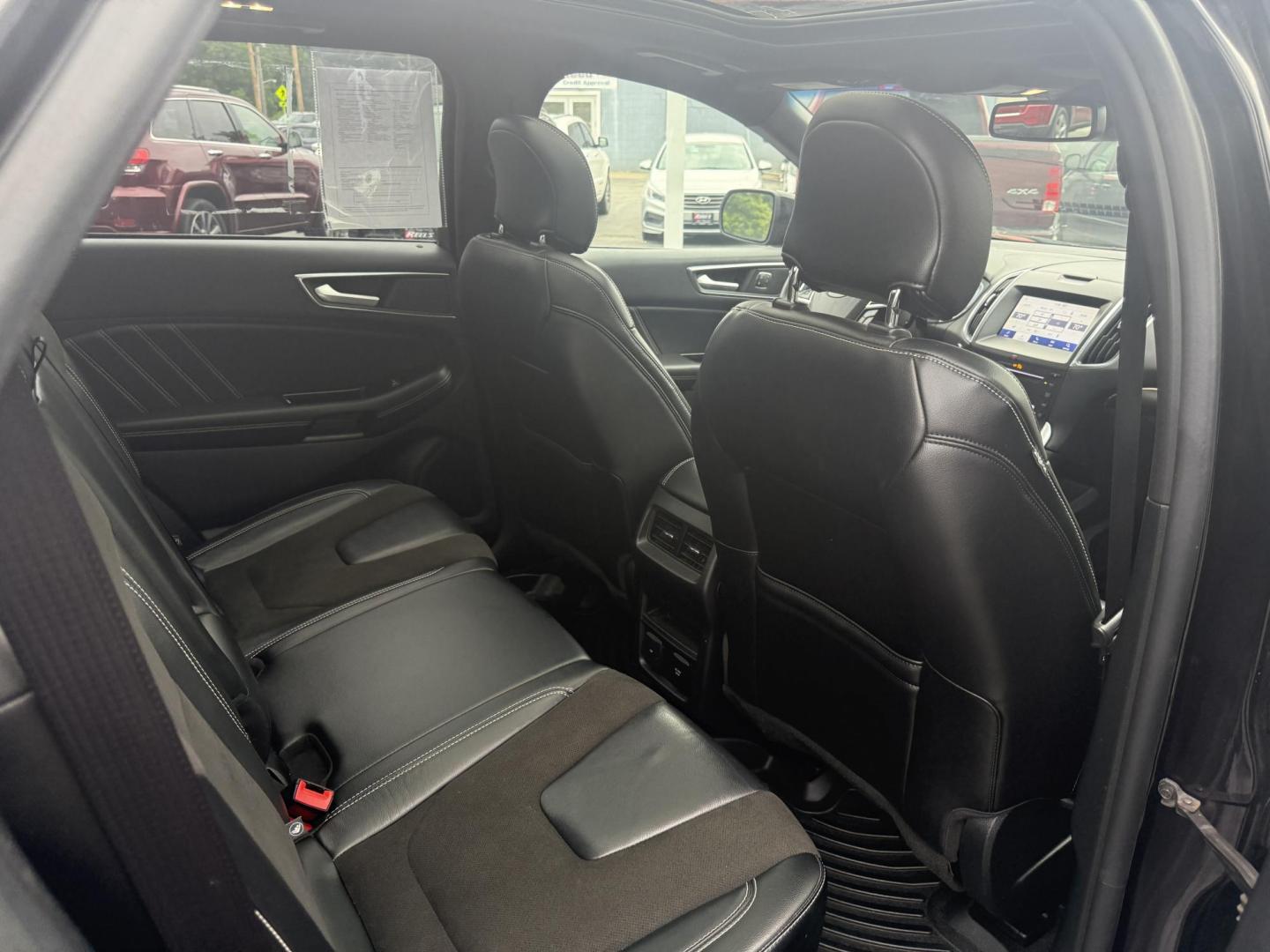 2019 Black /Black Ford Edge ST AWD (2FMPK4AP7KB) with an 2.7L V6 DOCH 24V Twin Turbo engine, 8-Speed Automatic transmission, located at 547 E. Main St., Orwell, OH, 44076, (440) 437-5893, 41.535435, -80.847855 - This 2019 Ford Edge ST AWD is a sporty midsize SUV featuring a 2.7L twin-turbo EcoBoost V6 engine paired with a 8-speed automatic transmission, delivering a robust 0-60 mph time of 5.7 seconds. Inside, it boasts leather and suede heated power front seats, a 12-speaker B&O sound system, an 8-inch tou - Photo#37
