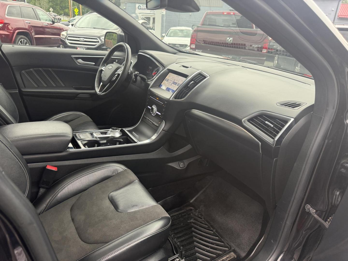 2019 Black /Black Ford Edge ST AWD (2FMPK4AP7KB) with an 2.7L V6 DOCH 24V Twin Turbo engine, 8-Speed Automatic transmission, located at 547 E. Main St., Orwell, OH, 44076, (440) 437-5893, 41.535435, -80.847855 - This 2019 Ford Edge ST AWD is a sporty midsize SUV featuring a 2.7L twin-turbo EcoBoost V6 engine paired with a 8-speed automatic transmission, delivering a robust 0-60 mph time of 5.7 seconds. Inside, it boasts leather and suede heated power front seats, a 12-speaker B&O sound system, an 8-inch tou - Photo#38