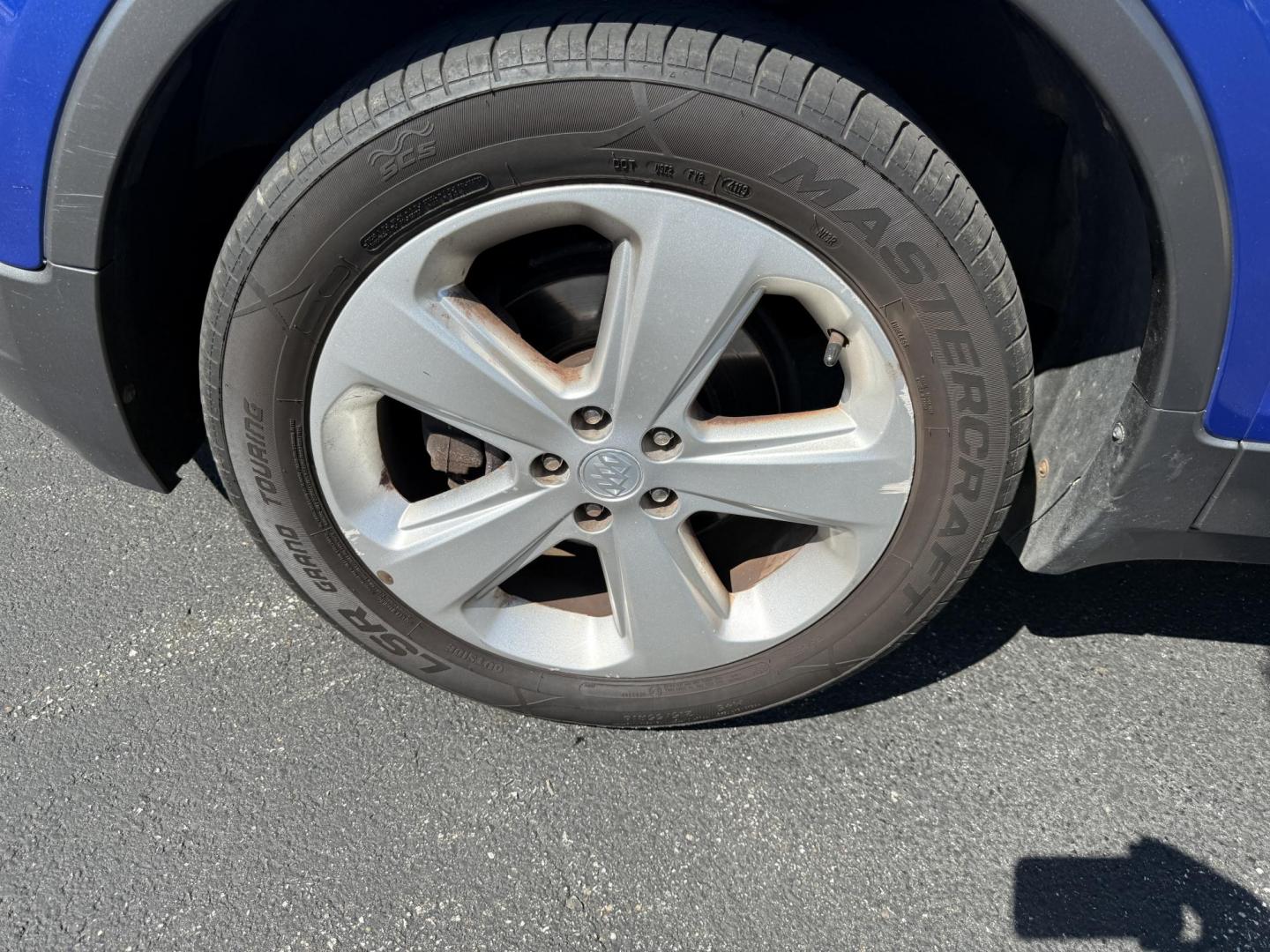 2015 Blue /Gray Buick Encore Leather AWD (KL4CJGSB8FB) with an 1.4L I4 DOHC 16V TURBO engine, 6A transmission, located at 11115 Chardon Rd. , Chardon, OH, 44024, (440) 214-9705, 41.580246, -81.241943 - The 2015 Buick Encore Leather AWD is a compact SUV featuring a 1.4L turbocharged I4 EcoTec engine paired with a 6-speed automatic transmission, offering a balance of power and efficiency at an estimated 30 MPG highway. This model boasts a premium leather interior with power-adjustable, heated front - Photo#6