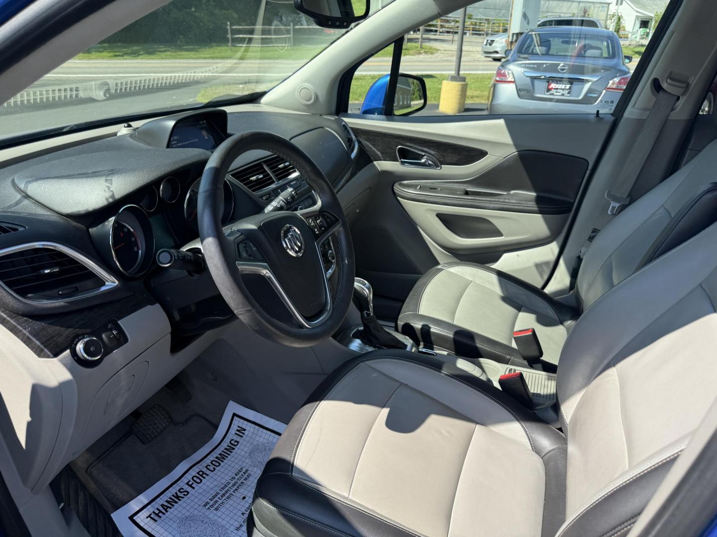 2015 Blue /Gray Buick Encore Leather AWD (KL4CJGSB8FB) with an 1.4L I4 DOHC 16V TURBO engine, 6A transmission, located at 11115 Chardon Rd. , Chardon, OH, 44024, (440) 214-9705, 41.580246, -81.241943 - The 2015 Buick Encore Leather AWD is a compact SUV featuring a 1.4L turbocharged I4 EcoTec engine paired with a 6-speed automatic transmission, offering a balance of power and efficiency at an estimated 30 MPG highway. This model boasts a premium leather interior with power-adjustable, heated front - Photo#7