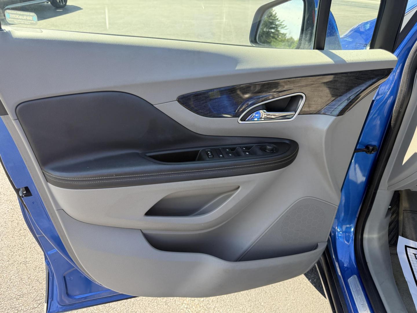 2015 Blue /Gray Buick Encore Leather AWD (KL4CJGSB8FB) with an 1.4L I4 DOHC 16V TURBO engine, 6A transmission, located at 11115 Chardon Rd. , Chardon, OH, 44024, (440) 214-9705, 41.580246, -81.241943 - The 2015 Buick Encore Leather AWD is a compact SUV featuring a 1.4L turbocharged I4 EcoTec engine paired with a 6-speed automatic transmission, offering a balance of power and efficiency at an estimated 30 MPG highway. This model boasts a premium leather interior with power-adjustable, heated front - Photo#8