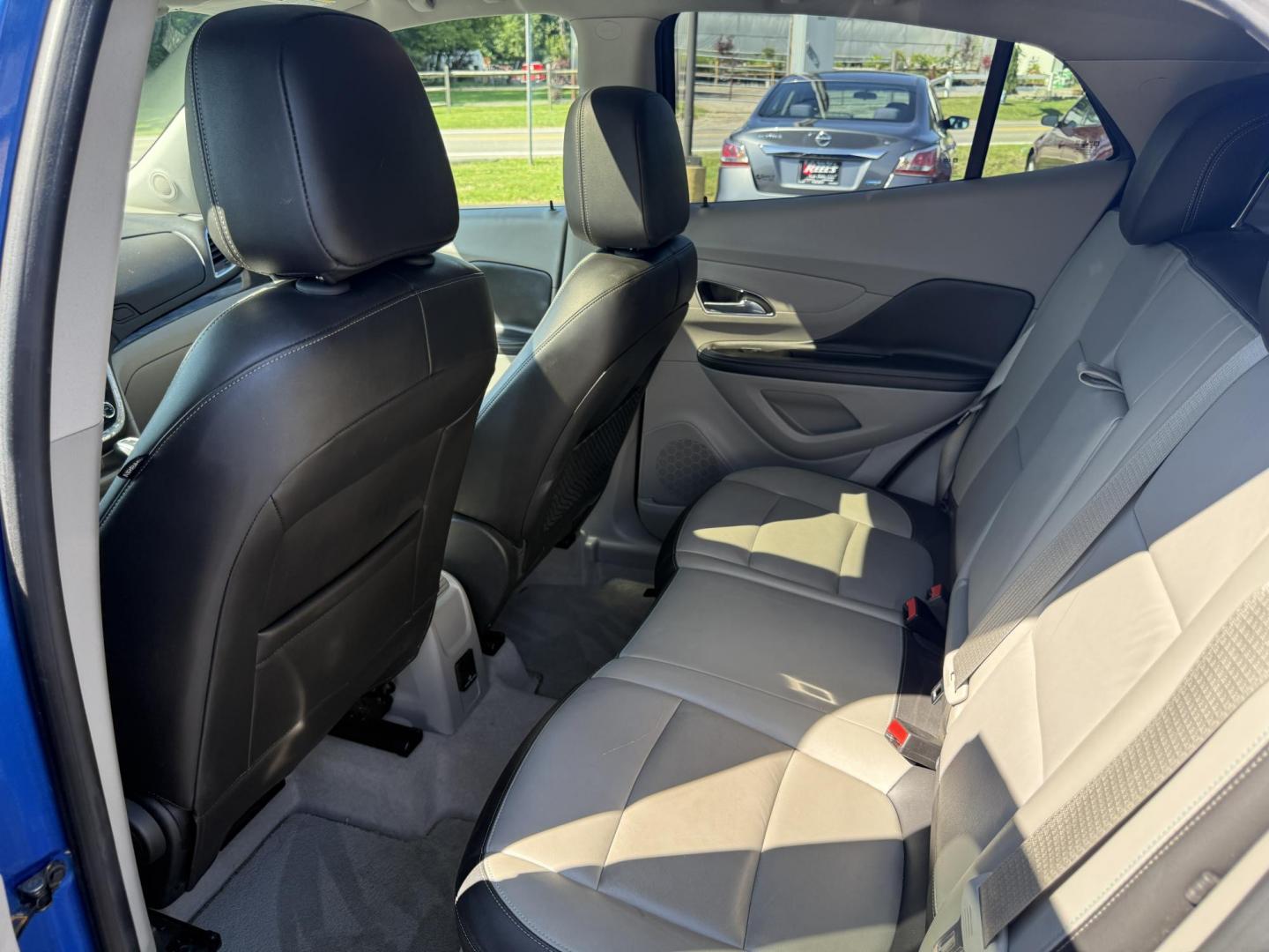 2015 Blue /Gray Buick Encore Leather AWD (KL4CJGSB8FB) with an 1.4L I4 DOHC 16V TURBO engine, 6A transmission, located at 11115 Chardon Rd. , Chardon, OH, 44024, (440) 214-9705, 41.580246, -81.241943 - The 2015 Buick Encore Leather AWD is a compact SUV featuring a 1.4L turbocharged I4 EcoTec engine paired with a 6-speed automatic transmission, offering a balance of power and efficiency at an estimated 30 MPG highway. This model boasts a premium leather interior with power-adjustable, heated front - Photo#24
