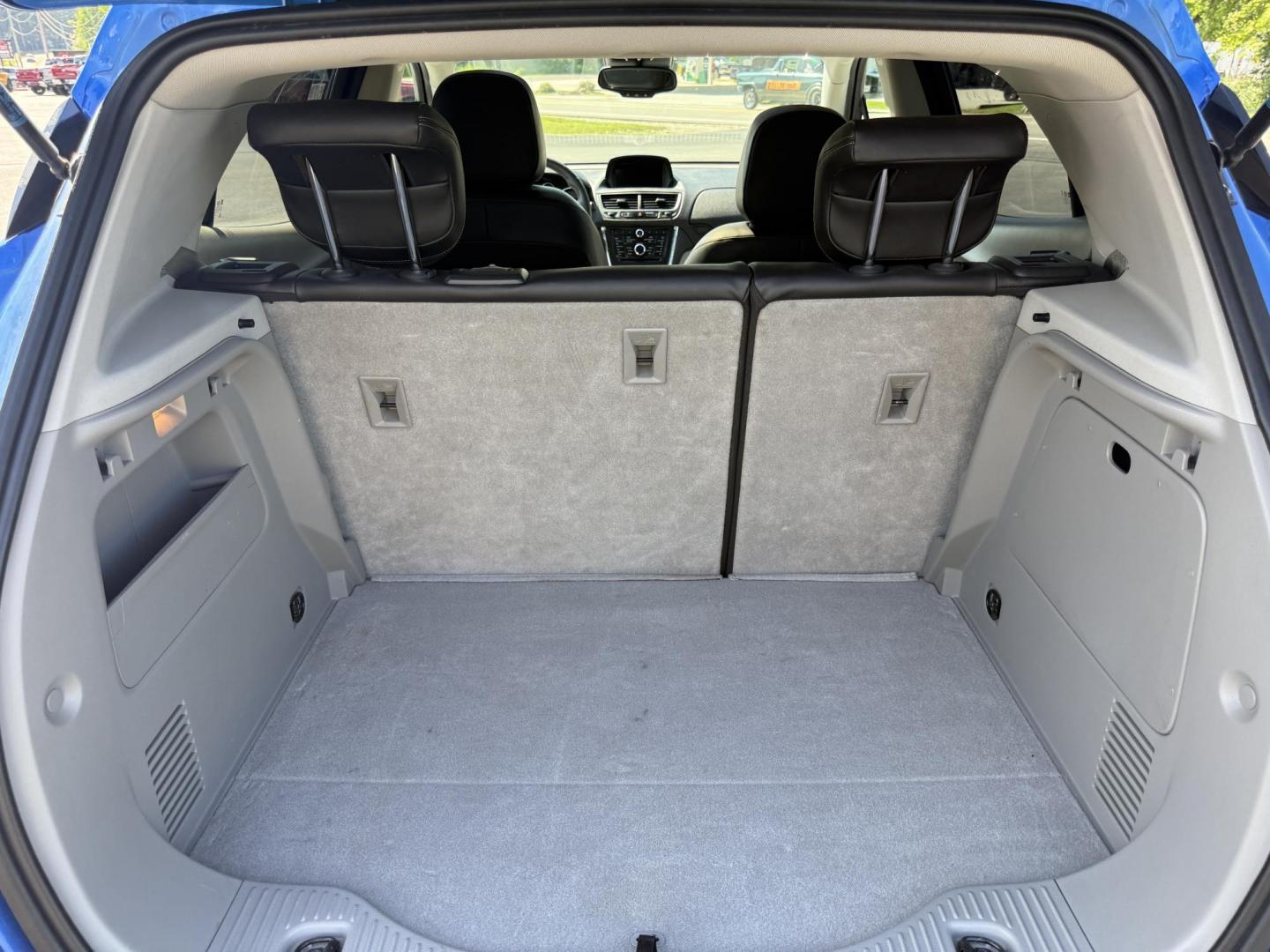2015 Blue /Gray Buick Encore Leather AWD (KL4CJGSB8FB) with an 1.4L I4 DOHC 16V TURBO engine, 6A transmission, located at 11115 Chardon Rd. , Chardon, OH, 44024, (440) 214-9705, 41.580246, -81.241943 - The 2015 Buick Encore Leather AWD is a compact SUV featuring a 1.4L turbocharged I4 EcoTec engine paired with a 6-speed automatic transmission, offering a balance of power and efficiency at an estimated 30 MPG highway. This model boasts a premium leather interior with power-adjustable, heated front - Photo#28