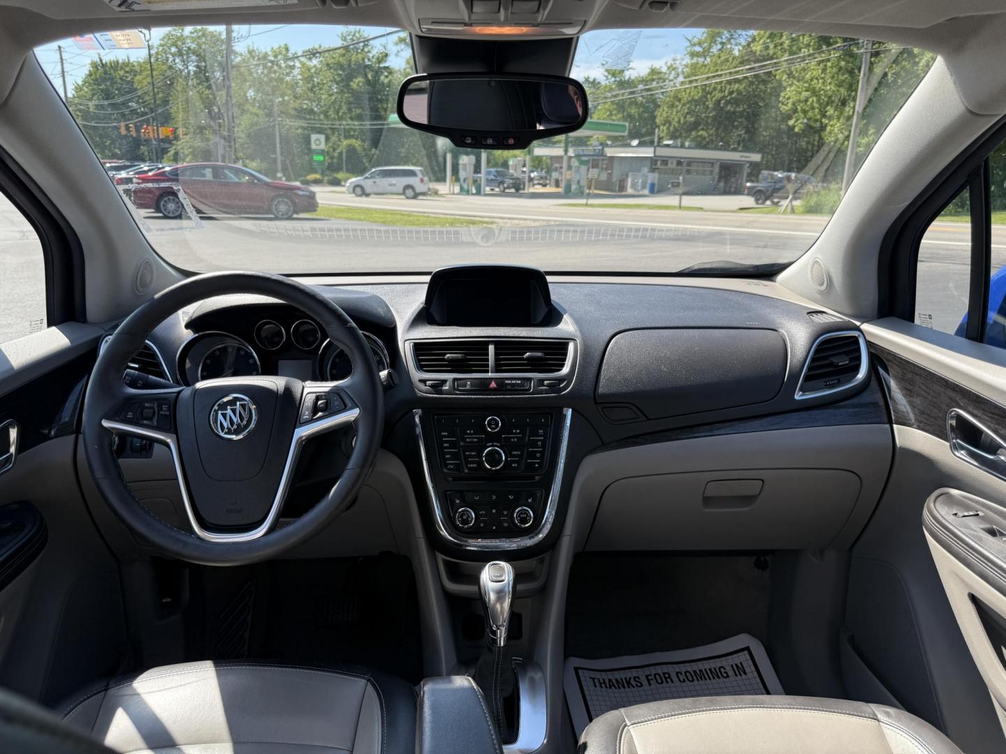 2015 Blue /Gray Buick Encore Leather AWD (KL4CJGSB8FB) with an 1.4L I4 DOHC 16V TURBO engine, 6A transmission, located at 11115 Chardon Rd. , Chardon, OH, 44024, (440) 214-9705, 41.580246, -81.241943 - The 2015 Buick Encore Leather AWD is a compact SUV featuring a 1.4L turbocharged I4 EcoTec engine paired with a 6-speed automatic transmission, offering a balance of power and efficiency at an estimated 30 MPG highway. This model boasts a premium leather interior with power-adjustable, heated front - Photo#27
