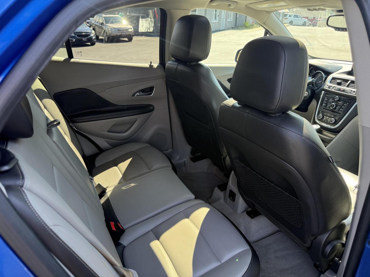 2015 Blue /Gray Buick Encore Leather AWD (KL4CJGSB8FB) with an 1.4L I4 DOHC 16V TURBO engine, 6A transmission, located at 11115 Chardon Rd. , Chardon, OH, 44024, (440) 214-9705, 41.580246, -81.241943 - The 2015 Buick Encore Leather AWD is a compact SUV featuring a 1.4L turbocharged I4 EcoTec engine paired with a 6-speed automatic transmission, offering a balance of power and efficiency at an estimated 30 MPG highway. This model boasts a premium leather interior with power-adjustable, heated front - Photo#30