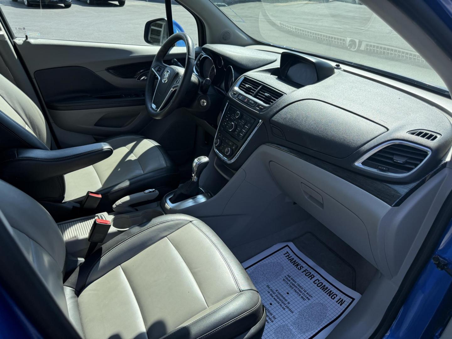 2015 Blue /Gray Buick Encore Leather AWD (KL4CJGSB8FB) with an 1.4L I4 DOHC 16V TURBO engine, 6A transmission, located at 11115 Chardon Rd. , Chardon, OH, 44024, (440) 214-9705, 41.580246, -81.241943 - The 2015 Buick Encore Leather AWD is a compact SUV featuring a 1.4L turbocharged I4 EcoTec engine paired with a 6-speed automatic transmission, offering a balance of power and efficiency at an estimated 30 MPG highway. This model boasts a premium leather interior with power-adjustable, heated front - Photo#32