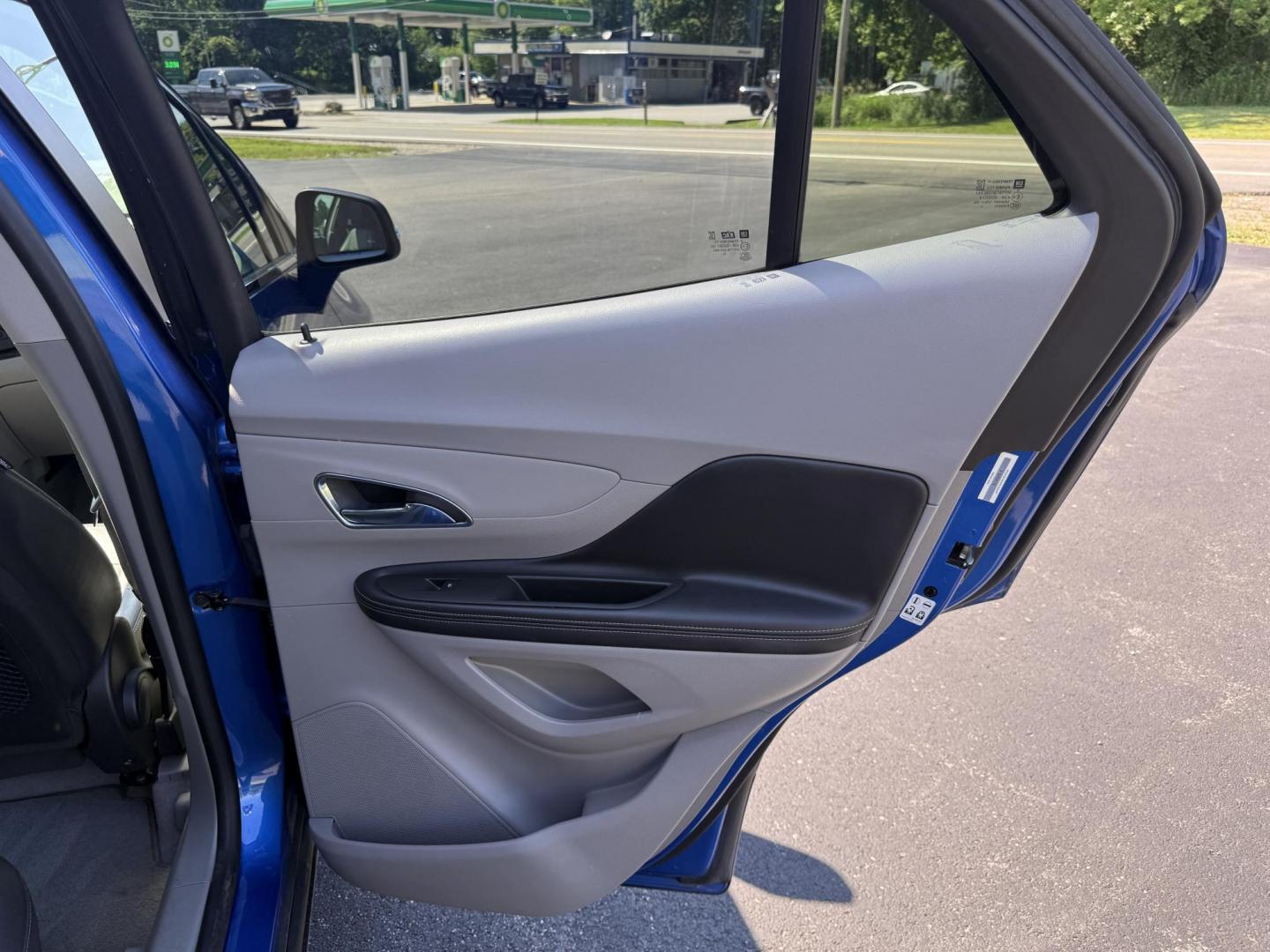 2015 Blue /Gray Buick Encore Leather AWD (KL4CJGSB8FB) with an 1.4L I4 DOHC 16V TURBO engine, 6A transmission, located at 11115 Chardon Rd. , Chardon, OH, 44024, (440) 214-9705, 41.580246, -81.241943 - The 2015 Buick Encore Leather AWD is a compact SUV featuring a 1.4L turbocharged I4 EcoTec engine paired with a 6-speed automatic transmission, offering a balance of power and efficiency at an estimated 30 MPG highway. This model boasts a premium leather interior with power-adjustable, heated front - Photo#31