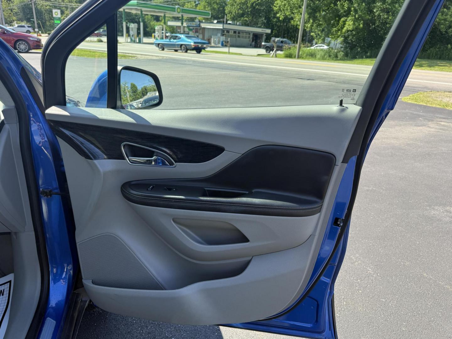 2015 Blue /Gray Buick Encore Leather AWD (KL4CJGSB8FB) with an 1.4L I4 DOHC 16V TURBO engine, 6A transmission, located at 11115 Chardon Rd. , Chardon, OH, 44024, (440) 214-9705, 41.580246, -81.241943 - The 2015 Buick Encore Leather AWD is a compact SUV featuring a 1.4L turbocharged I4 EcoTec engine paired with a 6-speed automatic transmission, offering a balance of power and efficiency at an estimated 30 MPG highway. This model boasts a premium leather interior with power-adjustable, heated front - Photo#37