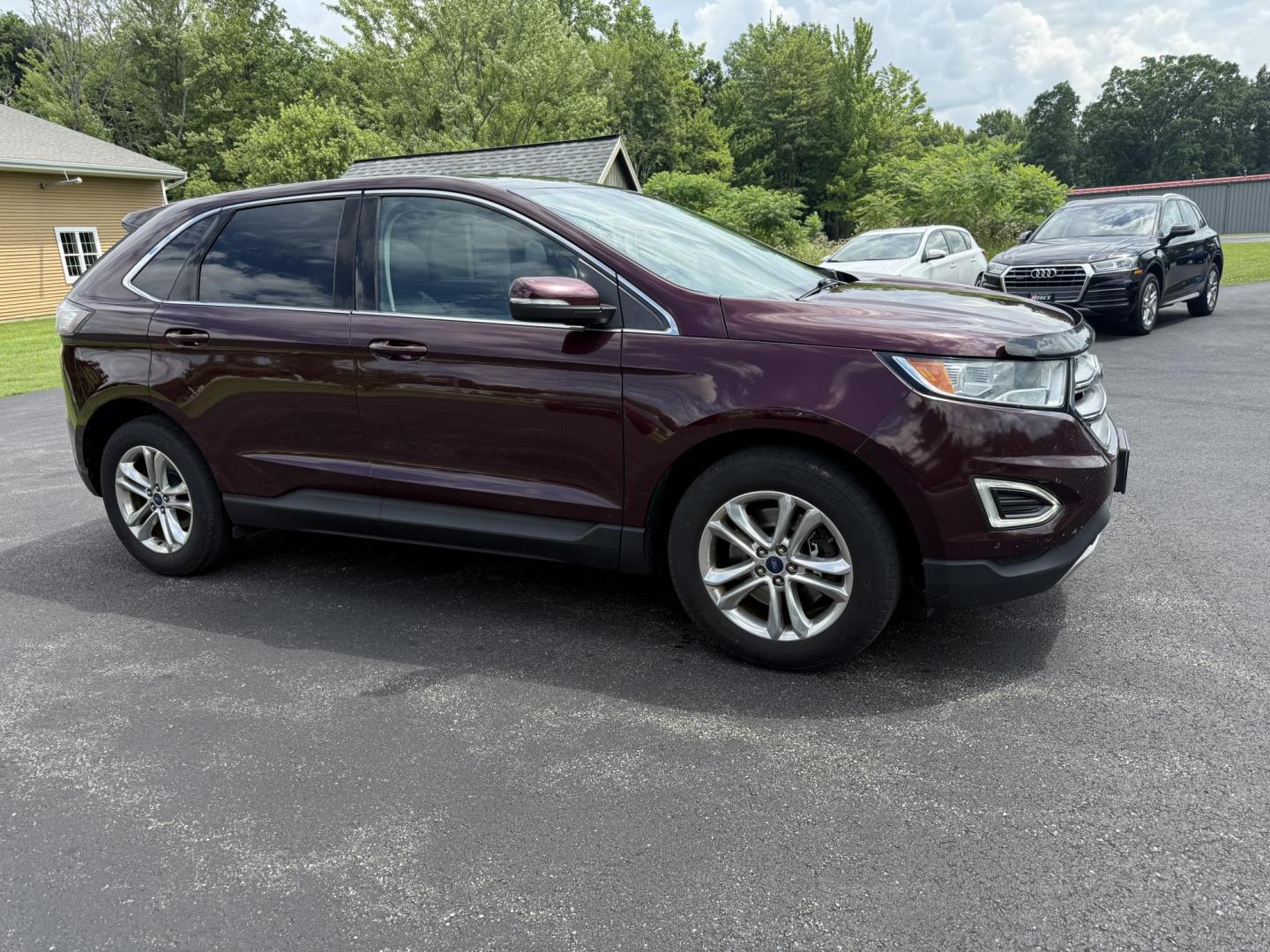 2017 Burgundy /Black Ford Edge SEL AWD (2FMPK4J99HB) with an 2.0L L4 DOHC 16V engine, 6A transmission, located at 11115 Chardon Rd. , Chardon, OH, 44024, (440) 214-9705, 41.580246, -81.241943 - This 2017 Ford Edge SEL AWD is a midsize SUV featuring a turbocharged 2.0L EcoBoost I4 engine and a 6-speed automatic transmission, achieving up to 27 MPG on the highway. It offers a premium leather interior with heated front seats, a power panoramic moonroof, an 8-inch touchscreen with navigation, - Photo#3