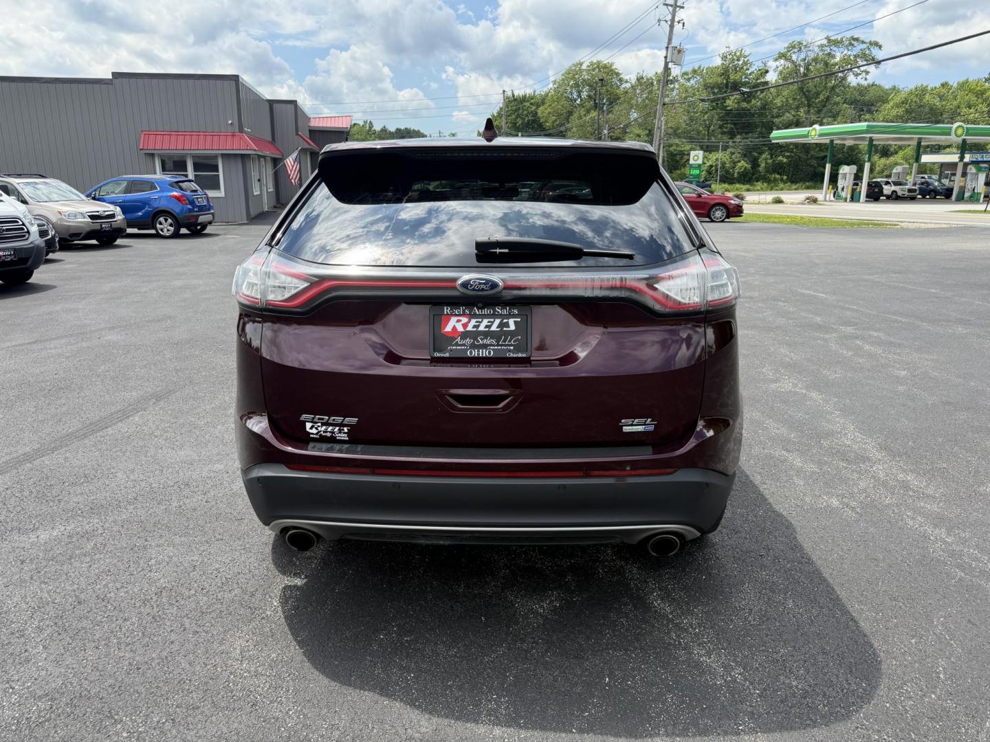 2017 Burgundy /Black Ford Edge SEL AWD (2FMPK4J99HB) with an 2.0L L4 DOHC 16V engine, 6A transmission, located at 11115 Chardon Rd. , Chardon, OH, 44024, (440) 214-9705, 41.580246, -81.241943 - This 2017 Ford Edge SEL AWD is a midsize SUV featuring a turbocharged 2.0L EcoBoost I4 engine and a 6-speed automatic transmission, achieving up to 27 MPG on the highway. It offers a premium leather interior with heated front seats, a power panoramic moonroof, an 8-inch touchscreen with navigation, - Photo#8