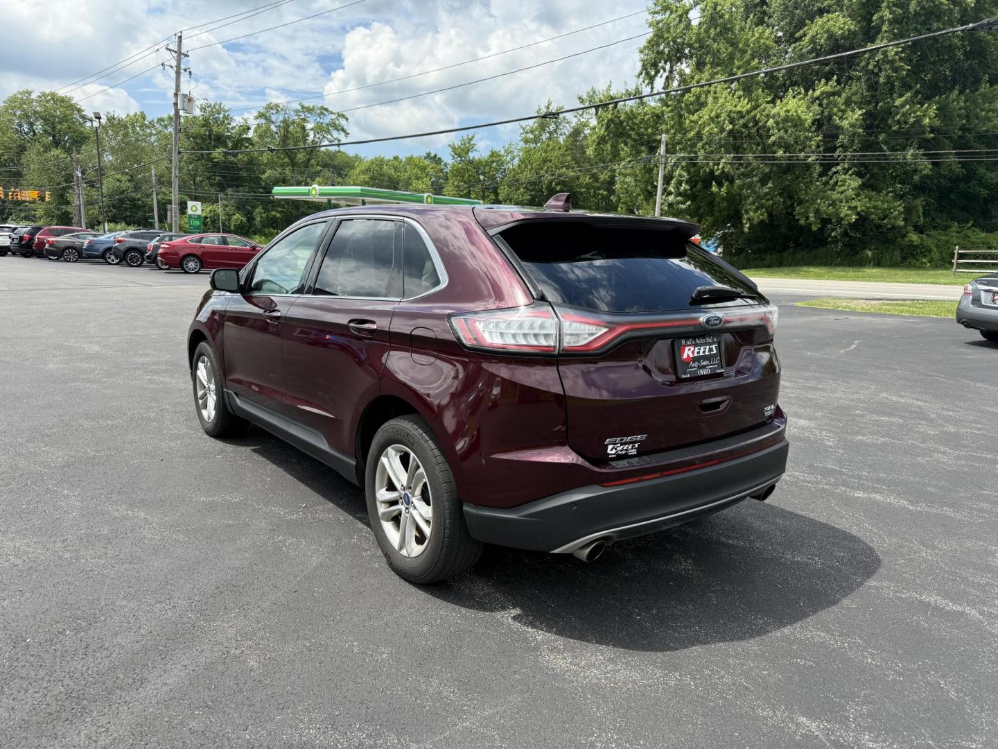 2017 Burgundy /Black Ford Edge SEL AWD (2FMPK4J99HB) with an 2.0L L4 DOHC 16V engine, 6A transmission, located at 11115 Chardon Rd. , Chardon, OH, 44024, (440) 214-9705, 41.580246, -81.241943 - This 2017 Ford Edge SEL AWD is a midsize SUV featuring a turbocharged 2.0L EcoBoost I4 engine and a 6-speed automatic transmission, achieving up to 27 MPG on the highway. It offers a premium leather interior with heated front seats, a power panoramic moonroof, an 8-inch touchscreen with navigation, - Photo#9