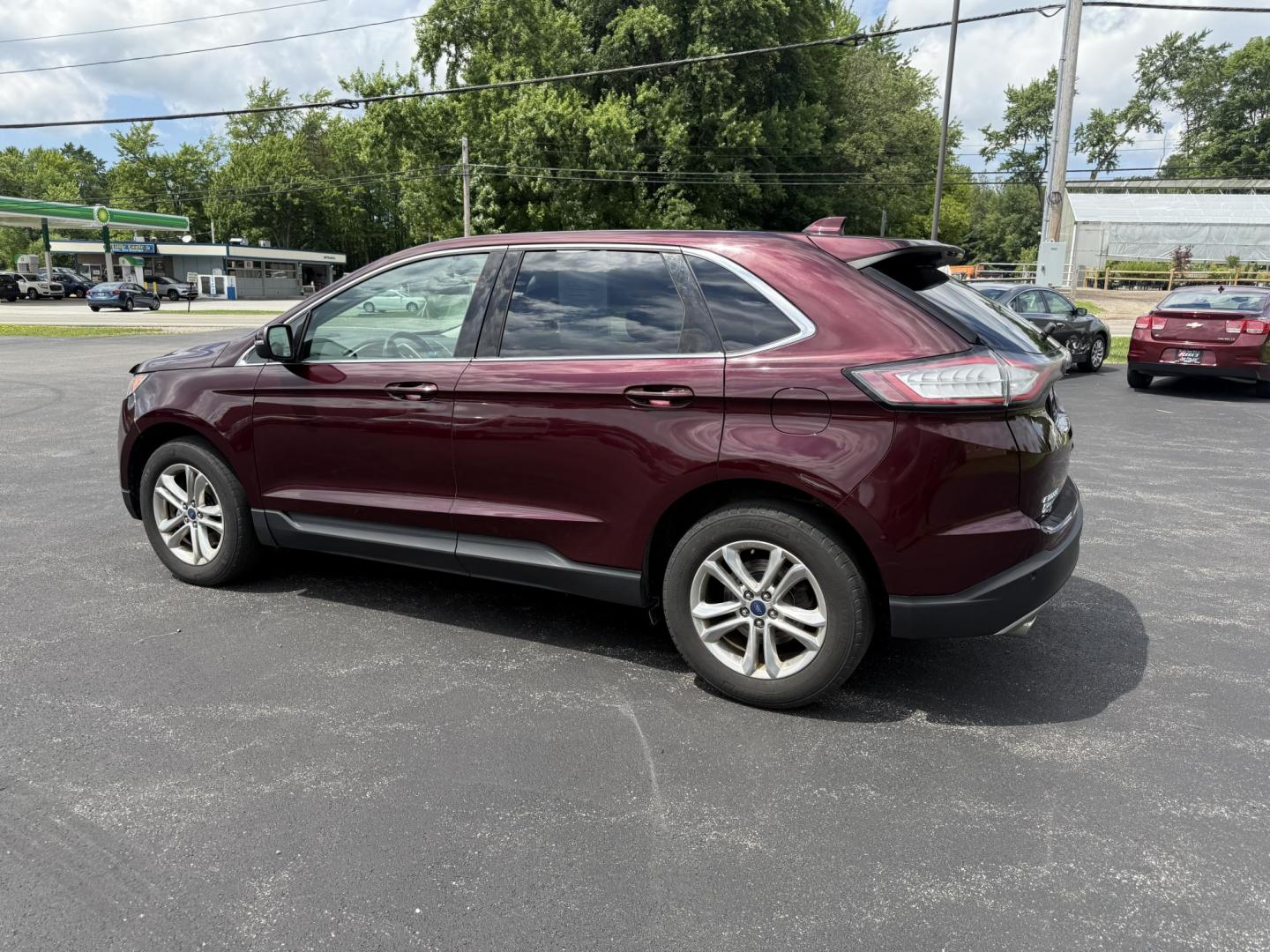 2017 Burgundy /Black Ford Edge SEL AWD (2FMPK4J99HB) with an 2.0L L4 DOHC 16V engine, 6A transmission, located at 11115 Chardon Rd. , Chardon, OH, 44024, (440) 214-9705, 41.580246, -81.241943 - This 2017 Ford Edge SEL AWD is a midsize SUV featuring a turbocharged 2.0L EcoBoost I4 engine and a 6-speed automatic transmission, achieving up to 27 MPG on the highway. It offers a premium leather interior with heated front seats, a power panoramic moonroof, an 8-inch touchscreen with navigation, - Photo#10