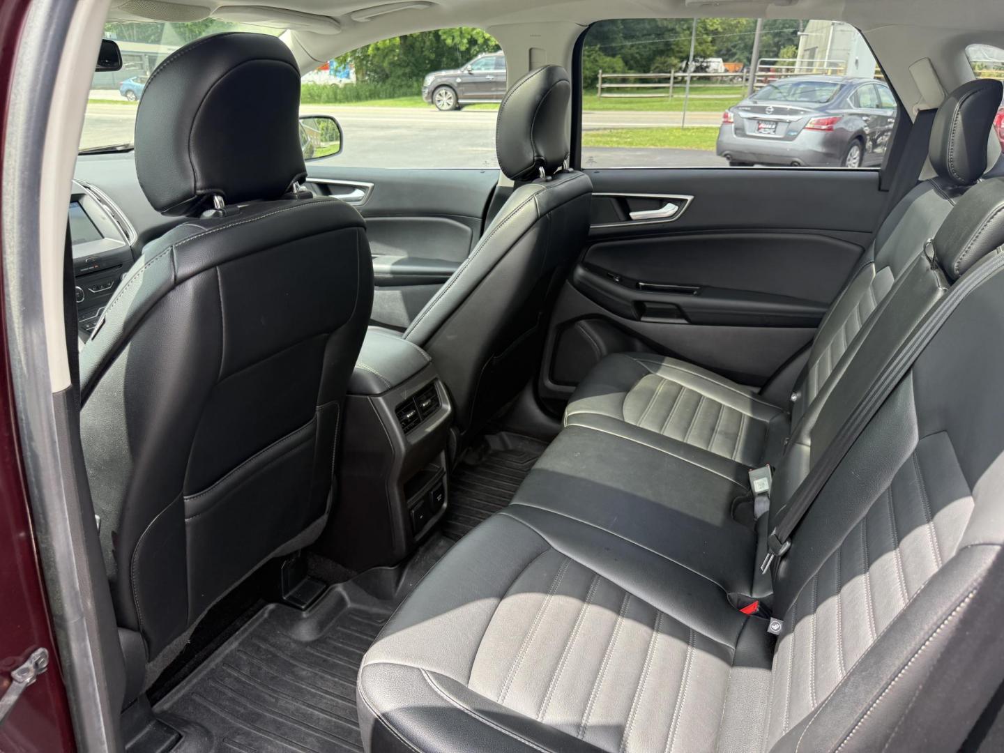2017 Burgundy /Black Ford Edge SEL AWD (2FMPK4J99HB) with an 2.0L L4 DOHC 16V engine, 6A transmission, located at 11115 Chardon Rd. , Chardon, OH, 44024, (440) 214-9705, 41.580246, -81.241943 - This 2017 Ford Edge SEL AWD is a midsize SUV featuring a turbocharged 2.0L EcoBoost I4 engine and a 6-speed automatic transmission, achieving up to 27 MPG on the highway. It offers a premium leather interior with heated front seats, a power panoramic moonroof, an 8-inch touchscreen with navigation, - Photo#33