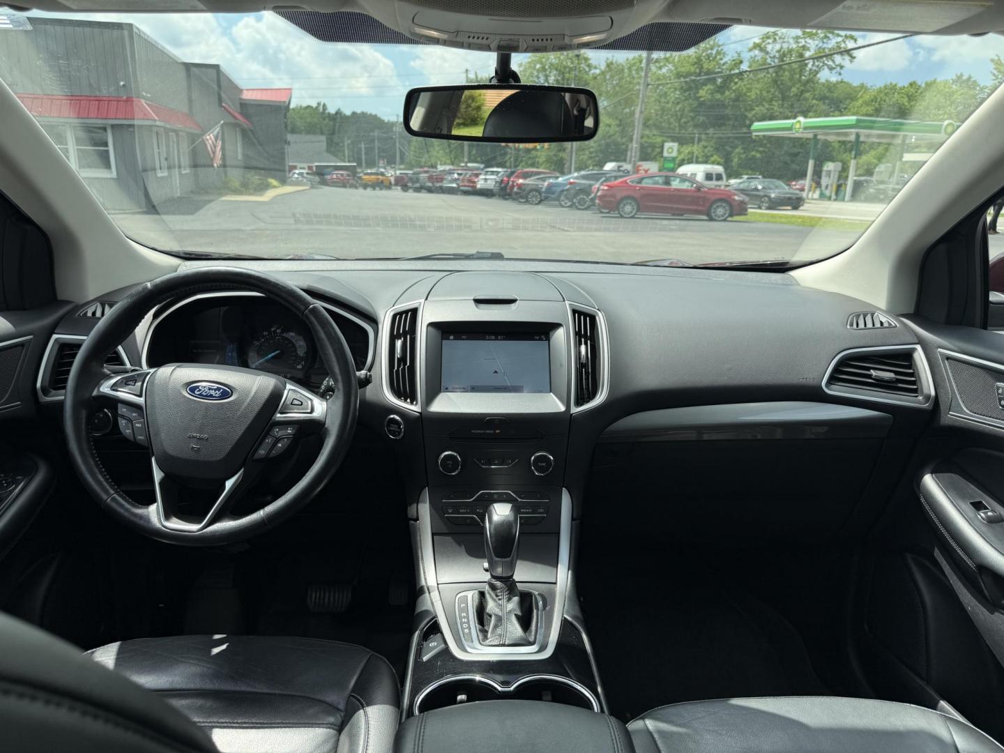 2017 Burgundy /Black Ford Edge SEL AWD (2FMPK4J99HB) with an 2.0L L4 DOHC 16V engine, 6A transmission, located at 11115 Chardon Rd. , Chardon, OH, 44024, (440) 214-9705, 41.580246, -81.241943 - This 2017 Ford Edge SEL AWD is a midsize SUV featuring a turbocharged 2.0L EcoBoost I4 engine and a 6-speed automatic transmission, achieving up to 27 MPG on the highway. It offers a premium leather interior with heated front seats, a power panoramic moonroof, an 8-inch touchscreen with navigation, - Photo#36