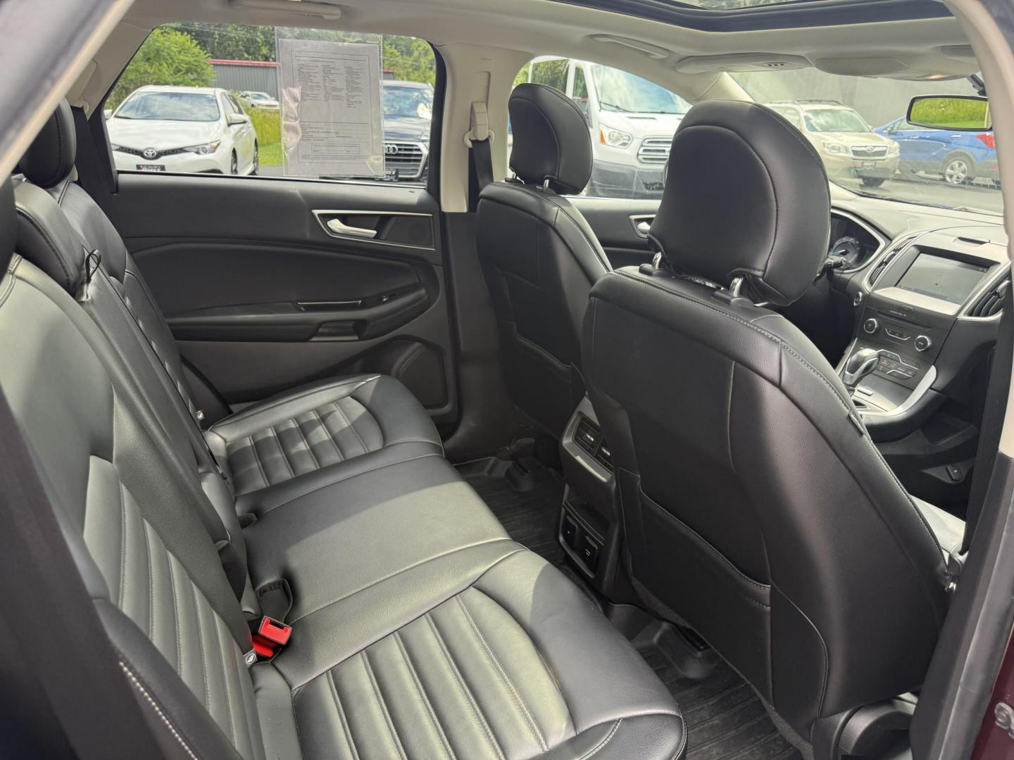 2017 Burgundy /Black Ford Edge SEL AWD (2FMPK4J99HB) with an 2.0L L4 DOHC 16V engine, 6A transmission, located at 11115 Chardon Rd. , Chardon, OH, 44024, (440) 214-9705, 41.580246, -81.241943 - This 2017 Ford Edge SEL AWD is a midsize SUV featuring a turbocharged 2.0L EcoBoost I4 engine and a 6-speed automatic transmission, achieving up to 27 MPG on the highway. It offers a premium leather interior with heated front seats, a power panoramic moonroof, an 8-inch touchscreen with navigation, - Photo#41