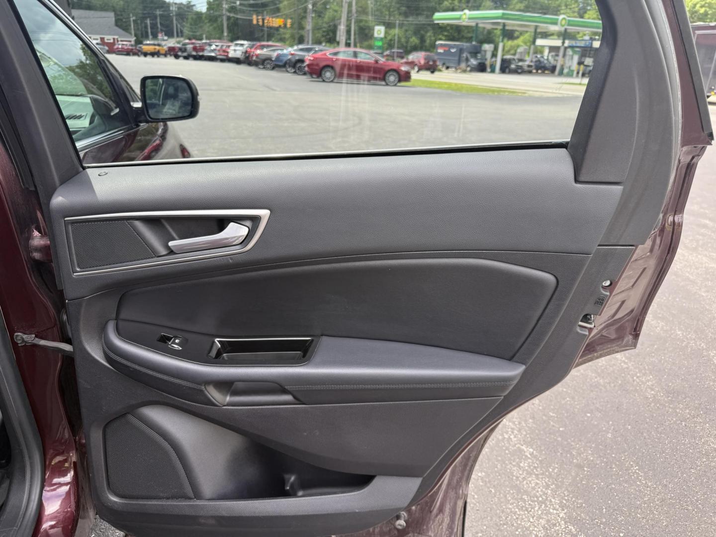 2017 Burgundy /Black Ford Edge SEL AWD (2FMPK4J99HB) with an 2.0L L4 DOHC 16V engine, 6A transmission, located at 11115 Chardon Rd. , Chardon, OH, 44024, (440) 214-9705, 41.580246, -81.241943 - This 2017 Ford Edge SEL AWD is a midsize SUV featuring a turbocharged 2.0L EcoBoost I4 engine and a 6-speed automatic transmission, achieving up to 27 MPG on the highway. It offers a premium leather interior with heated front seats, a power panoramic moonroof, an 8-inch touchscreen with navigation, - Photo#42