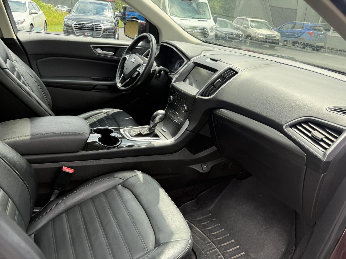 2017 Burgundy /Black Ford Edge SEL AWD (2FMPK4J99HB) with an 2.0L L4 DOHC 16V engine, 6A transmission, located at 11115 Chardon Rd. , Chardon, OH, 44024, (440) 214-9705, 41.580246, -81.241943 - This 2017 Ford Edge SEL AWD is a midsize SUV featuring a turbocharged 2.0L EcoBoost I4 engine and a 6-speed automatic transmission, achieving up to 27 MPG on the highway. It offers a premium leather interior with heated front seats, a power panoramic moonroof, an 8-inch touchscreen with navigation, - Photo#43