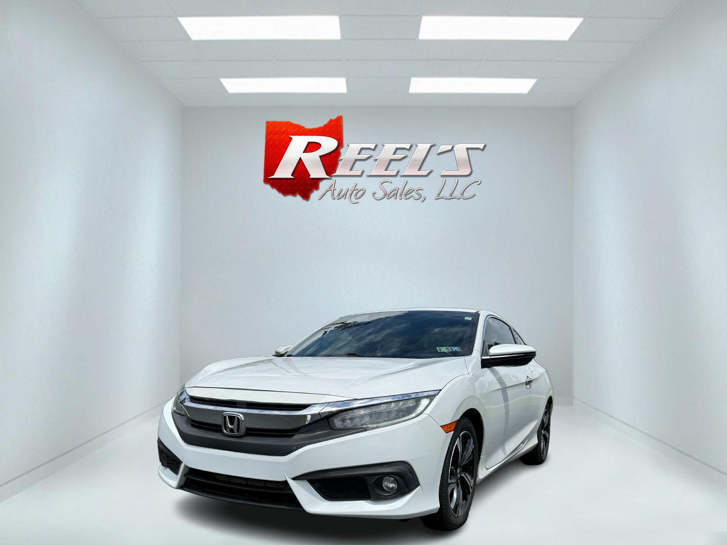 2017 White /Gray Honda Civic Touring Coupe CVT (2HGFC3B99HH) with an 1.5L I4 DOHC 16V Turbo engine, Automatic transmission, located at 11115 Chardon Rd. , Chardon, OH, 44024, (440) 214-9705, 41.580246, -81.241943 - FRESH TRADE ALERT ---- This 2017 Honda Civic Touring Coupe features a turbocharged 1.5L I4 engine, achieving an impressive 40 MPG highway, and comes equipped with a leather interior, heated front seats, dual-zone automatic climate control, and a 7-inch touchscreen supporting Apple CarPlay and Androi - Photo#0