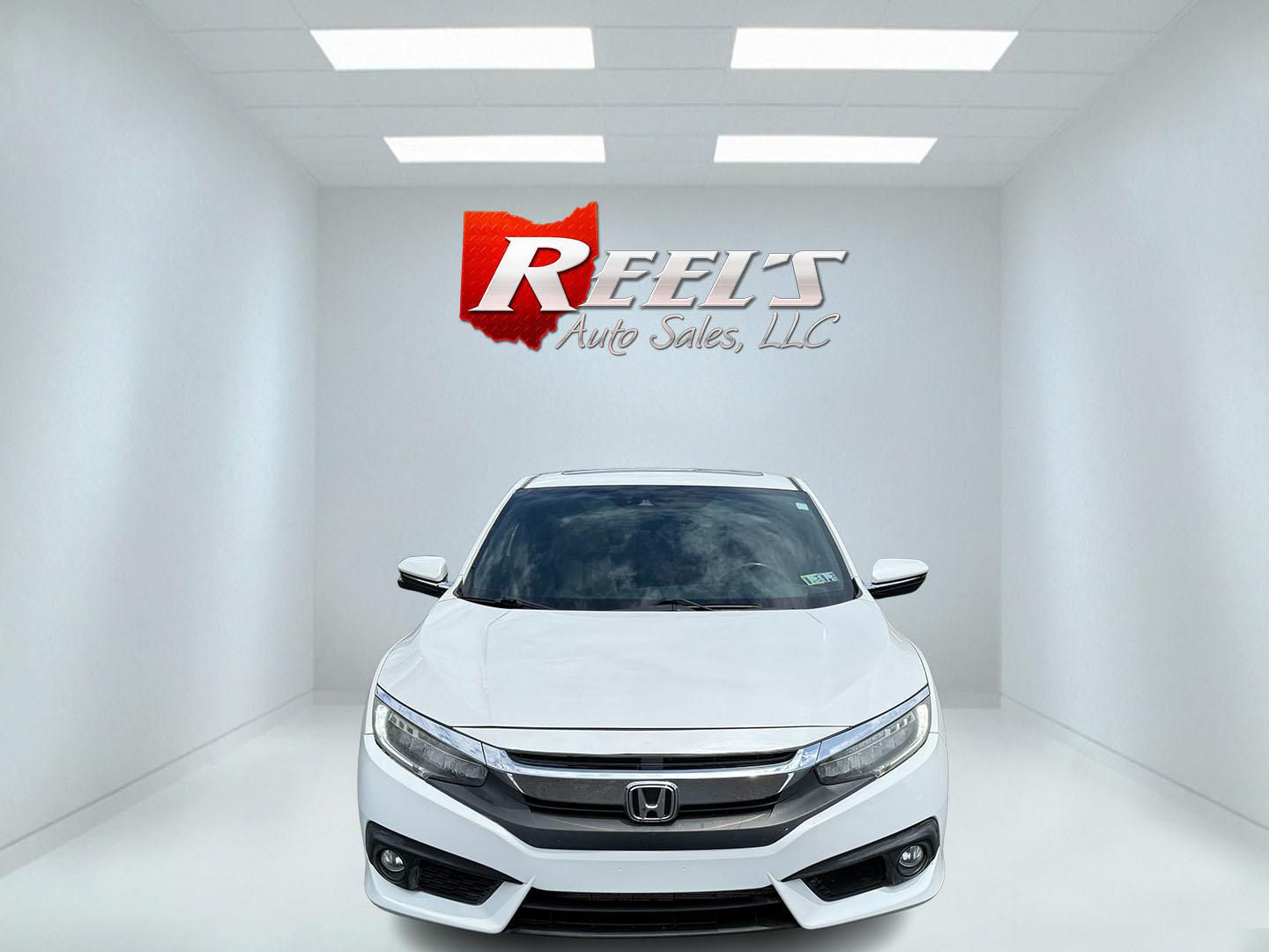 2017 White /Gray Honda Civic Touring Coupe CVT (2HGFC3B99HH) with an 1.5L I4 DOHC 16V Turbo engine, Automatic transmission, located at 11115 Chardon Rd. , Chardon, OH, 44024, (440) 214-9705, 41.580246, -81.241943 - FRESH TRADE ALERT ---- This 2017 Honda Civic Touring Coupe features a turbocharged 1.5L I4 engine, achieving an impressive 40 MPG highway, and comes equipped with a leather interior, heated front seats, dual-zone automatic climate control, and a 7-inch touchscreen supporting Apple CarPlay and Androi - Photo#1