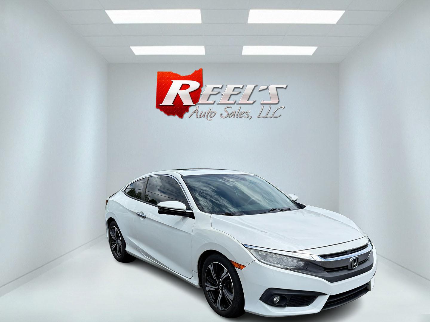2017 White /Gray Honda Civic Touring Coupe CVT (2HGFC3B99HH) with an 1.5L I4 DOHC 16V Turbo engine, Automatic transmission, located at 11115 Chardon Rd. , Chardon, OH, 44024, (440) 214-9705, 41.580246, -81.241943 - FRESH TRADE ALERT ---- This 2017 Honda Civic Touring Coupe features a turbocharged 1.5L I4 engine, achieving an impressive 40 MPG highway, and comes equipped with a leather interior, heated front seats, dual-zone automatic climate control, and a 7-inch touchscreen supporting Apple CarPlay and Androi - Photo#2