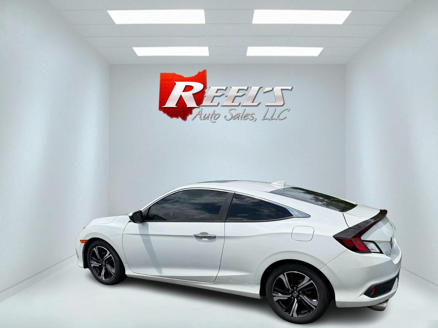 2017 White /Gray Honda Civic Touring Coupe CVT (2HGFC3B99HH) with an 1.5L I4 DOHC 16V Turbo engine, Automatic transmission, located at 11115 Chardon Rd. , Chardon, OH, 44024, (440) 214-9705, 41.580246, -81.241943 - FRESH TRADE ALERT ---- This 2017 Honda Civic Touring Coupe features a turbocharged 1.5L I4 engine, achieving an impressive 40 MPG highway, and comes equipped with a leather interior, heated front seats, dual-zone automatic climate control, and a 7-inch touchscreen supporting Apple CarPlay and Androi - Photo#31