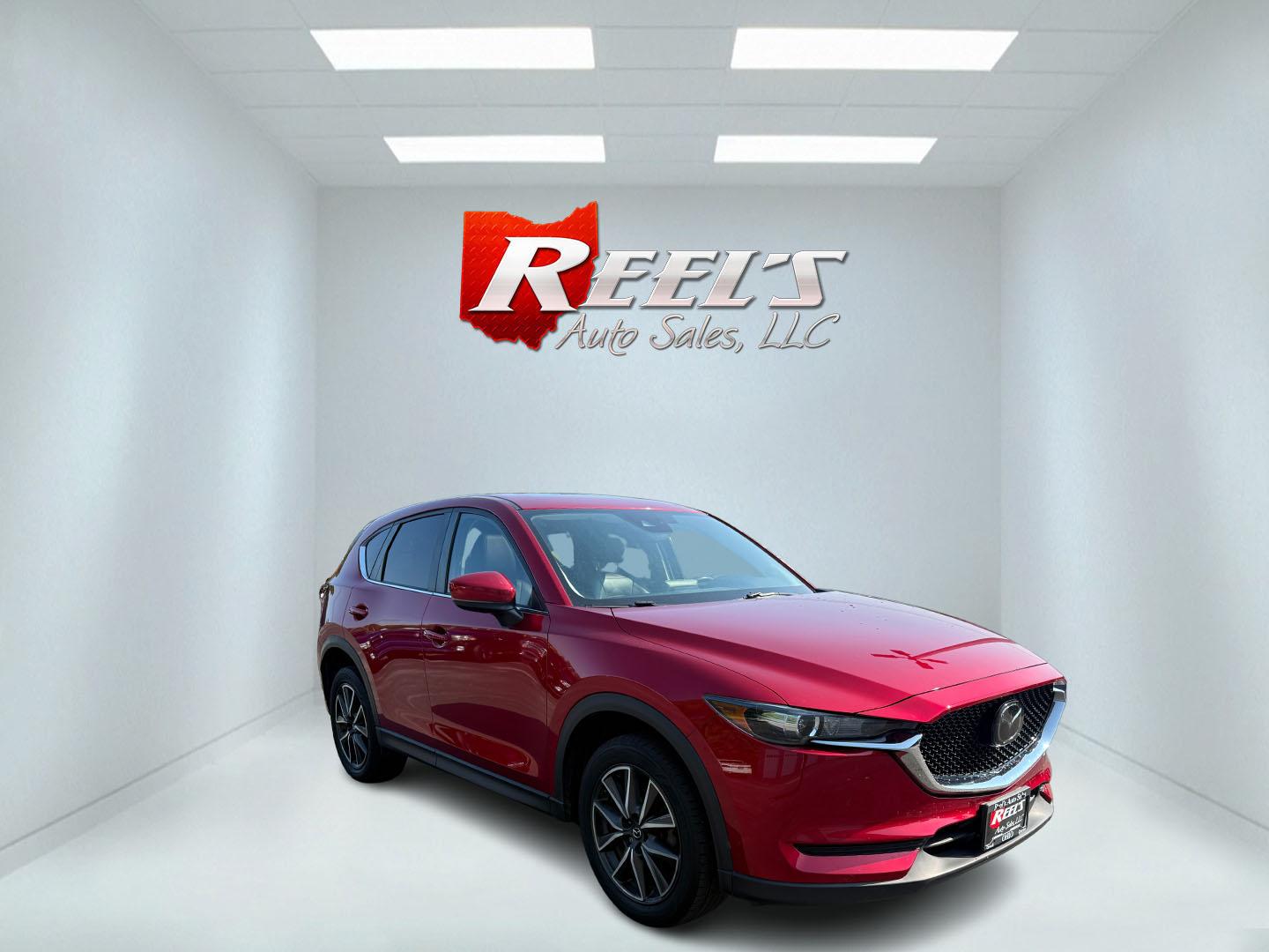 2018 Red /Black Mazda CX-5 Touring AWD (JM3KFBCM9J0) with an 2.5L I4 DOHC 16V engine, 6 Speed Automatic transmission, located at 547 E. Main St., Orwell, OH, 44076, (440) 437-5893, 41.535435, -80.847855 - This 2018 Mazda CX-5 Touring AWD with a 2.5L I4 engine and 6-speed automatic transmission offers a well-rounded package, delivering up to 30 MPG on the highway. It comes equipped with advanced safety features like Blind Spot Monitoring, Rear Cross Traffic Alert, and Adaptive Cruise Control, enhancin - Photo#2