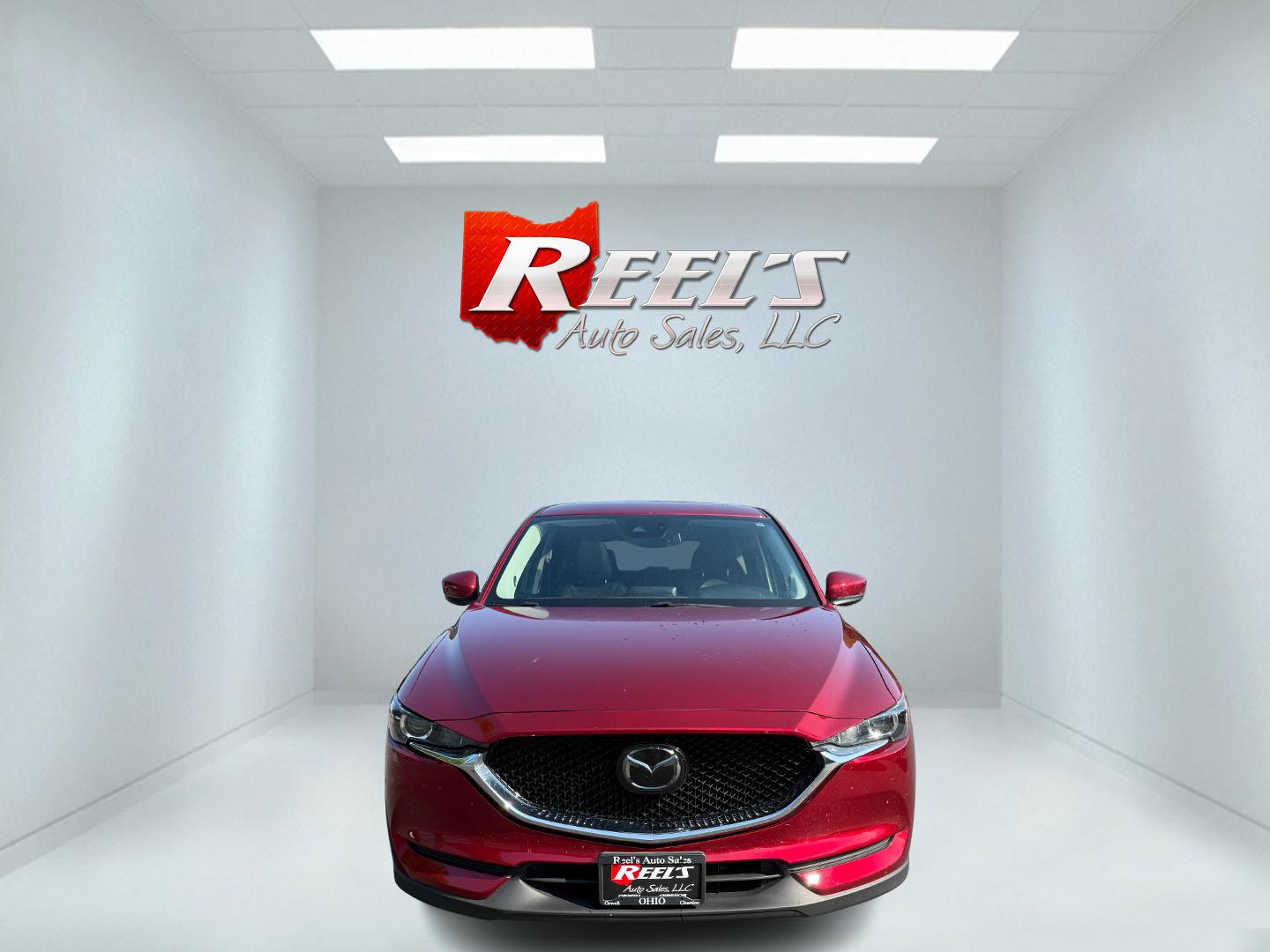 2018 Red /Black Mazda CX-5 Touring AWD (JM3KFBCM9J0) with an 2.5L I4 DOHC 16V engine, 6 Speed Automatic transmission, located at 547 E. Main St., Orwell, OH, 44076, (440) 437-5893, 41.535435, -80.847855 - This 2018 Mazda CX-5 Touring AWD with a 2.5L I4 engine and 6-speed automatic transmission offers a well-rounded package, delivering up to 30 MPG on the highway. It comes equipped with advanced safety features like Blind Spot Monitoring, Rear Cross Traffic Alert, and Adaptive Cruise Control, enhancin - Photo#1