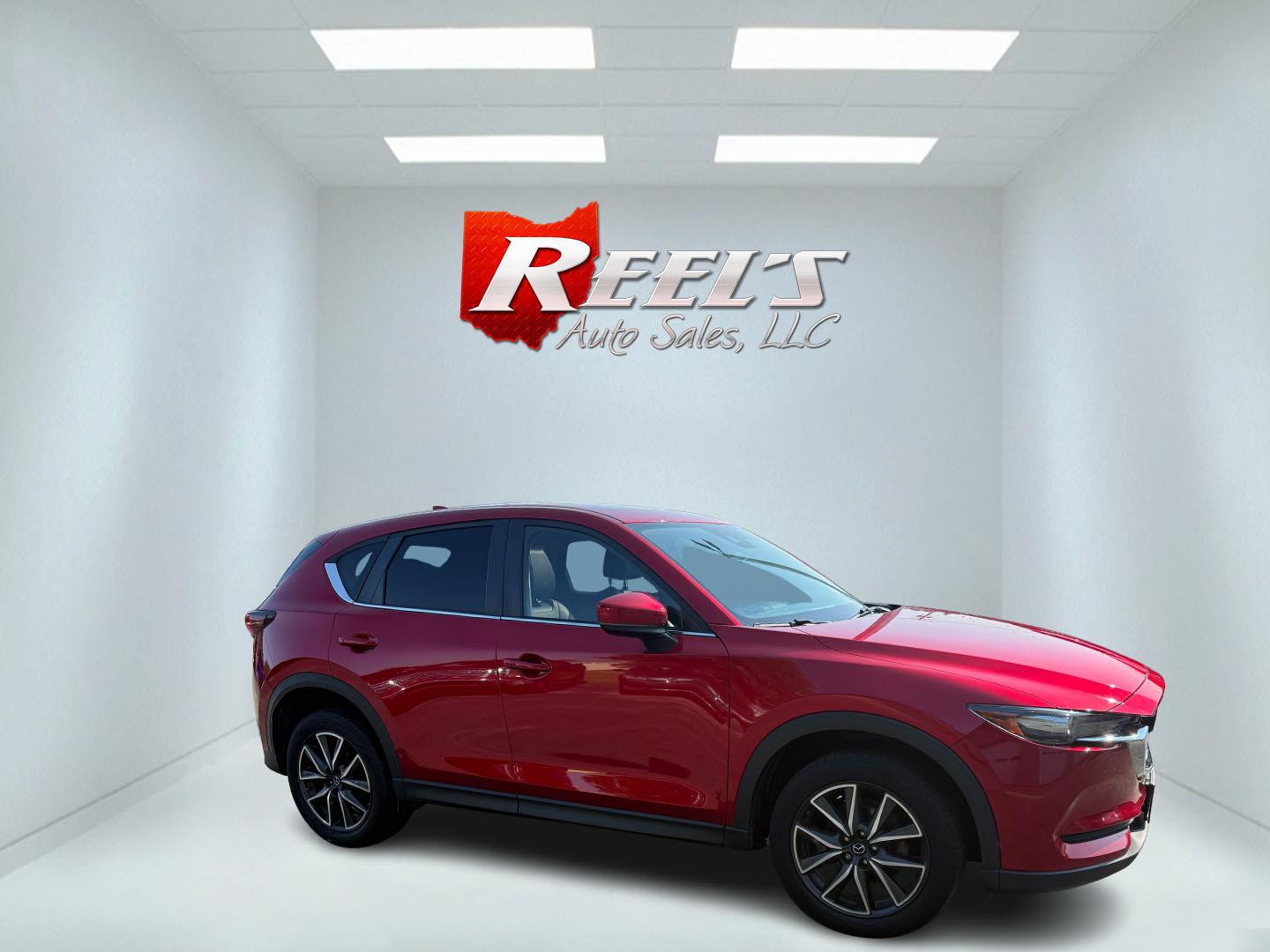 2018 Red /Black Mazda CX-5 Touring AWD (JM3KFBCM9J0) with an 2.5L I4 DOHC 16V engine, 6 Speed Automatic transmission, located at 547 E. Main St., Orwell, OH, 44076, (440) 437-5893, 41.535435, -80.847855 - This 2018 Mazda CX-5 Touring AWD with a 2.5L I4 engine and 6-speed automatic transmission offers a well-rounded package, delivering up to 30 MPG on the highway. It comes equipped with advanced safety features like Blind Spot Monitoring, Rear Cross Traffic Alert, and Adaptive Cruise Control, enhancin - Photo#39