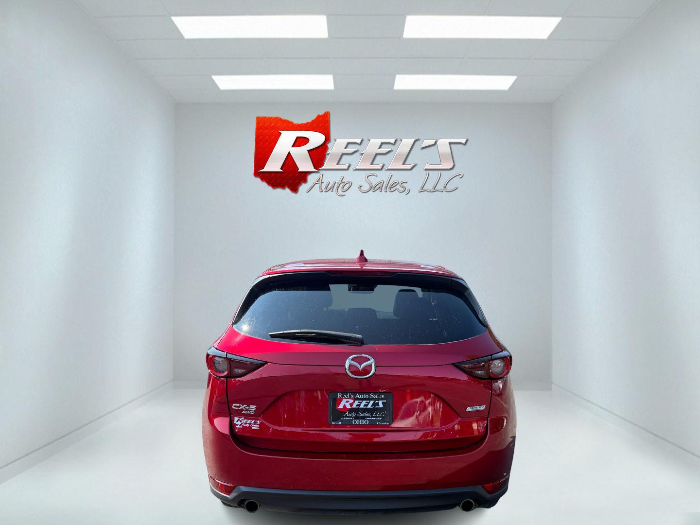 2018 Red /Black Mazda CX-5 Touring AWD (JM3KFBCM9J0) with an 2.5L I4 DOHC 16V engine, 6 Speed Automatic transmission, located at 547 E. Main St., Orwell, OH, 44076, (440) 437-5893, 41.535435, -80.847855 - This 2018 Mazda CX-5 Touring AWD with a 2.5L I4 engine and 6-speed automatic transmission offers a well-rounded package, delivering up to 30 MPG on the highway. It comes equipped with advanced safety features like Blind Spot Monitoring, Rear Cross Traffic Alert, and Adaptive Cruise Control, enhancin - Photo#42