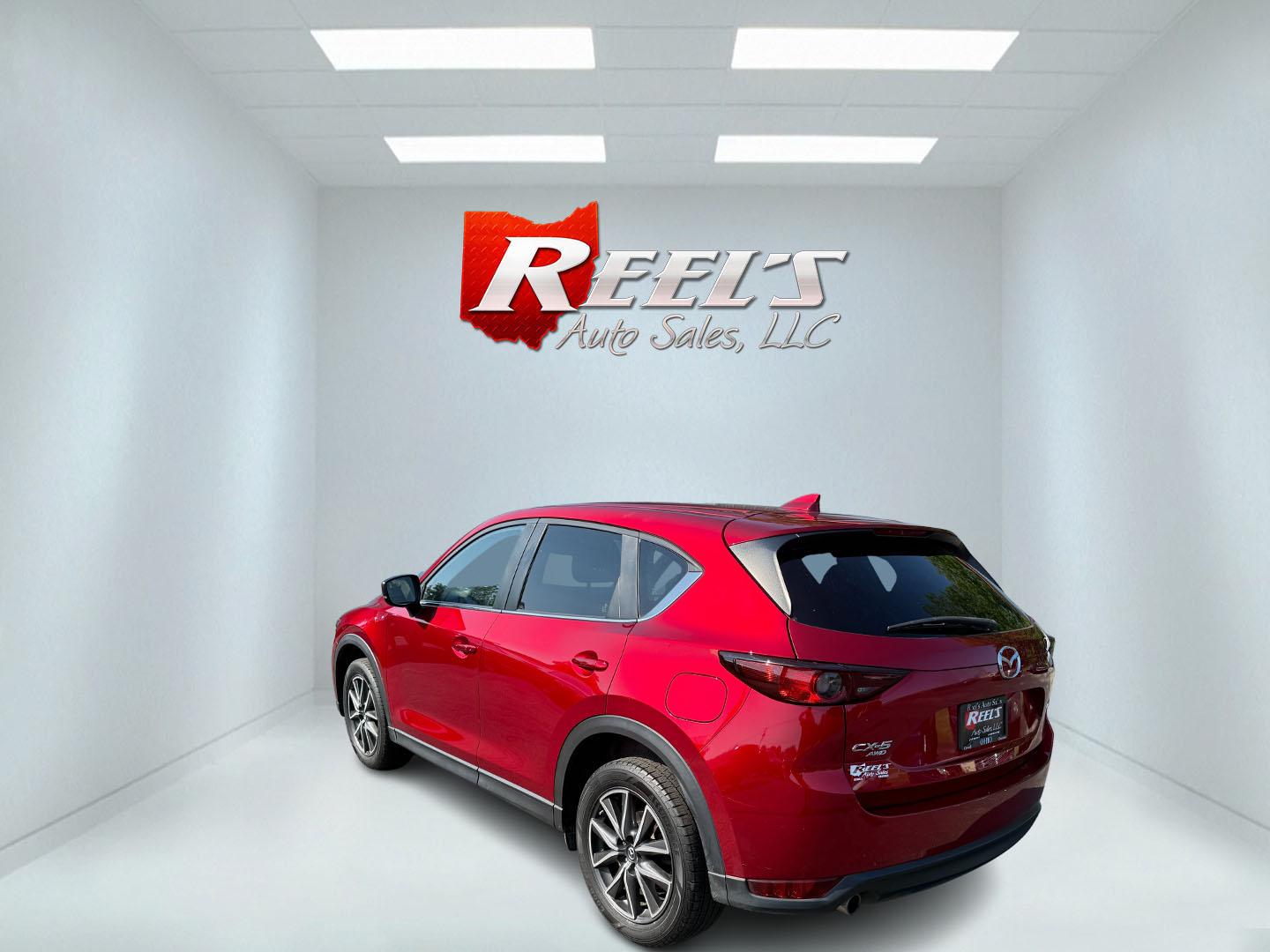 2018 Red /Black Mazda CX-5 Touring AWD (JM3KFBCM9J0) with an 2.5L I4 DOHC 16V engine, 6 Speed Automatic transmission, located at 547 E. Main St., Orwell, OH, 44076, (440) 437-5893, 41.535435, -80.847855 - This 2018 Mazda CX-5 Touring AWD with a 2.5L I4 engine and 6-speed automatic transmission offers a well-rounded package, delivering up to 30 MPG on the highway. It comes equipped with advanced safety features like Blind Spot Monitoring, Rear Cross Traffic Alert, and Adaptive Cruise Control, enhancin - Photo#43
