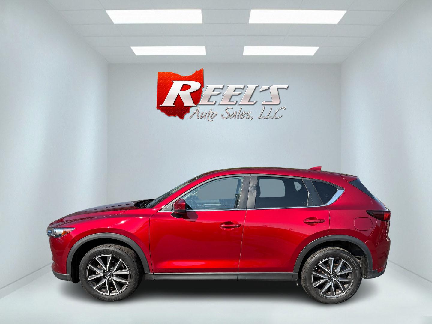 2018 Red /Black Mazda CX-5 Touring AWD (JM3KFBCM9J0) with an 2.5L I4 DOHC 16V engine, 6 Speed Automatic transmission, located at 547 E. Main St., Orwell, OH, 44076, (440) 437-5893, 41.535435, -80.847855 - This 2018 Mazda CX-5 Touring AWD with a 2.5L I4 engine and 6-speed automatic transmission offers a well-rounded package, delivering up to 30 MPG on the highway. It comes equipped with advanced safety features like Blind Spot Monitoring, Rear Cross Traffic Alert, and Adaptive Cruise Control, enhancin - Photo#45