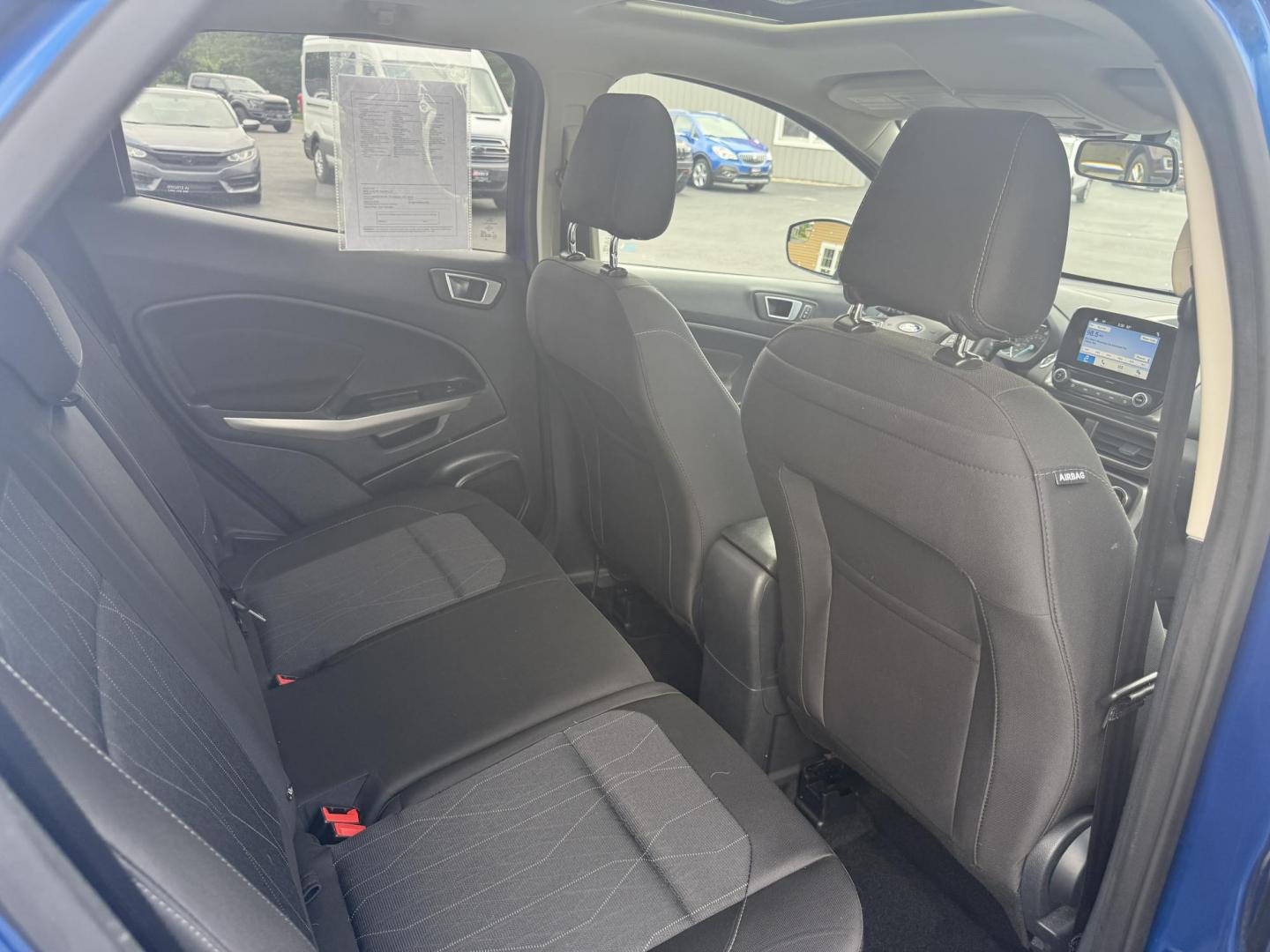 2018 Blue /Black Ford EcoSport SE (MAJ3P1TEXJC) with an 1.0L I3 Turbo engine, 6-Speed Automatic transmission, located at 11115 Chardon Rd. , Chardon, OH, 44024, (440) 214-9705, 41.580246, -81.241943 - This One Owner 2018 Ford EcoSport SE FWD is a compact SUV equipped with a 1.0-liter I3 turbocharged EcoBoost engine, paired with a 6-speed automatic transmission, offering an estimated 29 MPG on the highway. It features a range of convenient amenities including a power driver’s seat, single-zone a - Photo#28