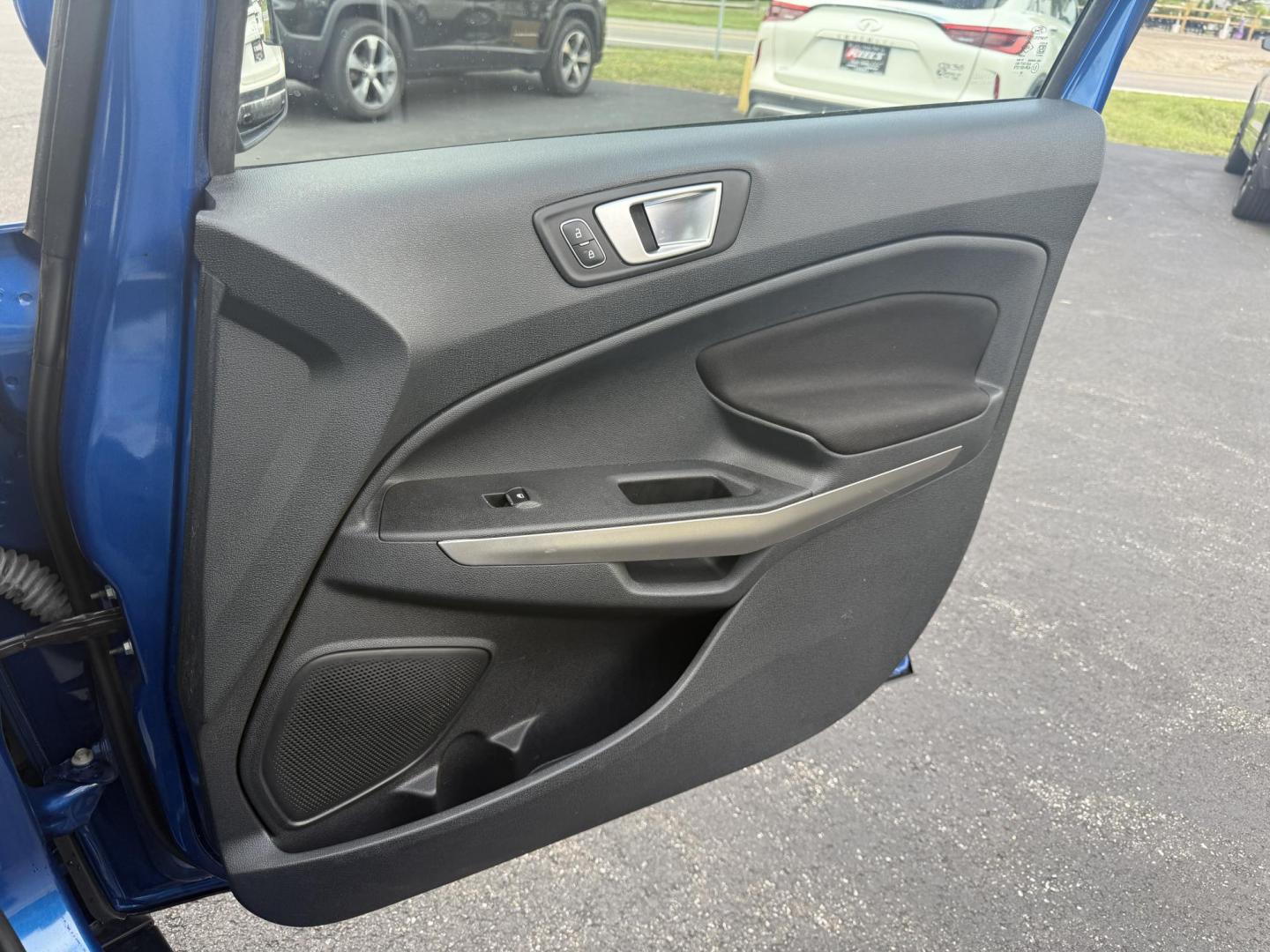 2018 Blue /Black Ford EcoSport SE (MAJ3P1TEXJC) with an 1.0L I3 Turbo engine, 6-Speed Automatic transmission, located at 11115 Chardon Rd. , Chardon, OH, 44024, (440) 214-9705, 41.580246, -81.241943 - This One Owner 2018 Ford EcoSport SE FWD is a compact SUV equipped with a 1.0-liter I3 turbocharged EcoBoost engine, paired with a 6-speed automatic transmission, offering an estimated 29 MPG on the highway. It features a range of convenient amenities including a power driver’s seat, single-zone a - Photo#32
