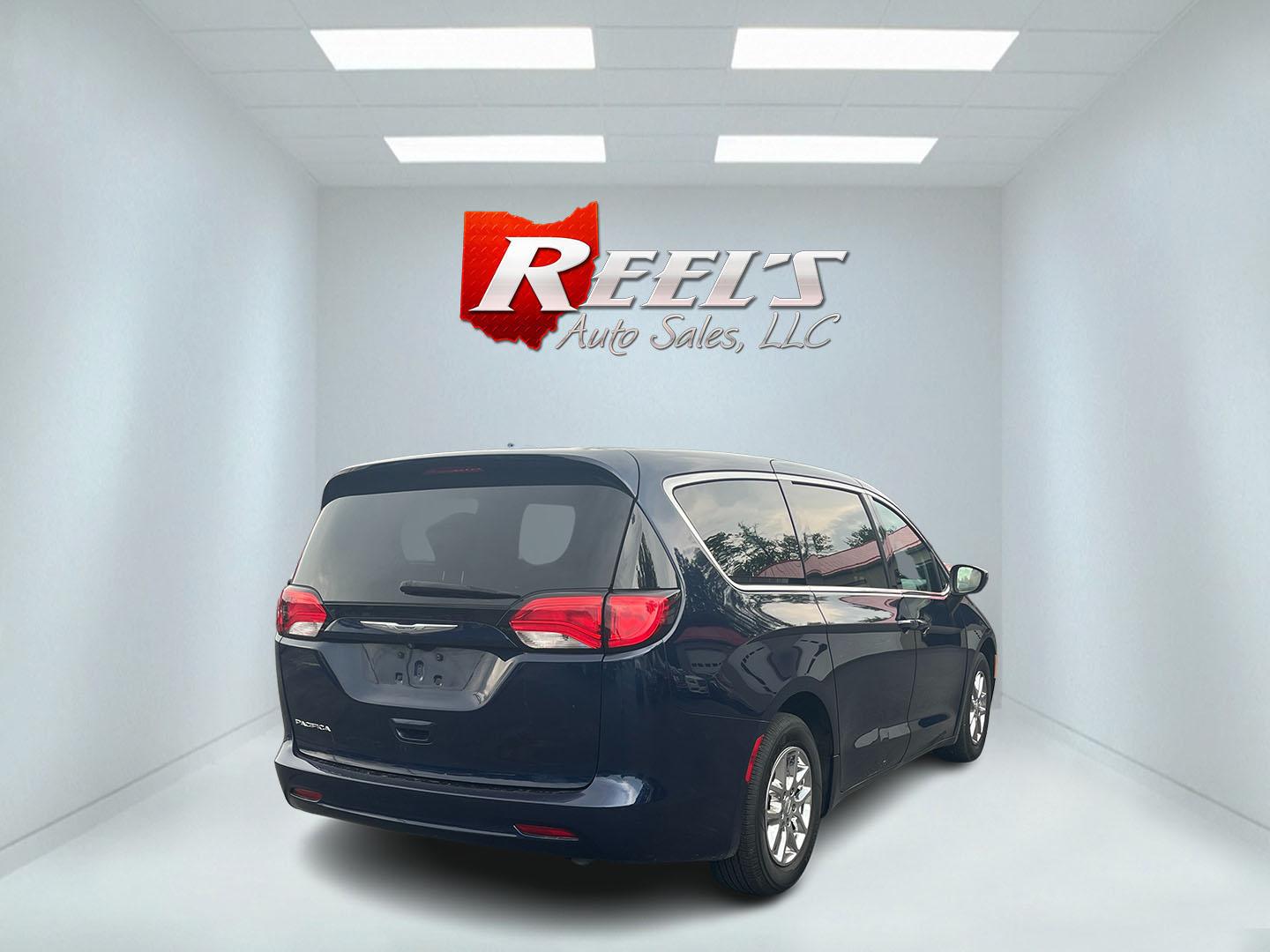 2017 Blue /Black Chrysler Pacifica Touring (2C4RC1DG8HR) with an 3.6L V6 DOHC 24V engine, 9A transmission, located at 547 E. Main St., Orwell, OH, 44076, (440) 437-5893, 41.535435, -80.847855 - This 2017 Chrysler Pacifica Touring is a versatile minivan powered by a 3.6-liter Pentastar V6 engine paired with a 9-speed automatic transmission, offering an impressive 28 MPG on the highway. It features a range of convenient amenities including a power driver’s seat, power liftgate, an 8.4-inch - Photo#35