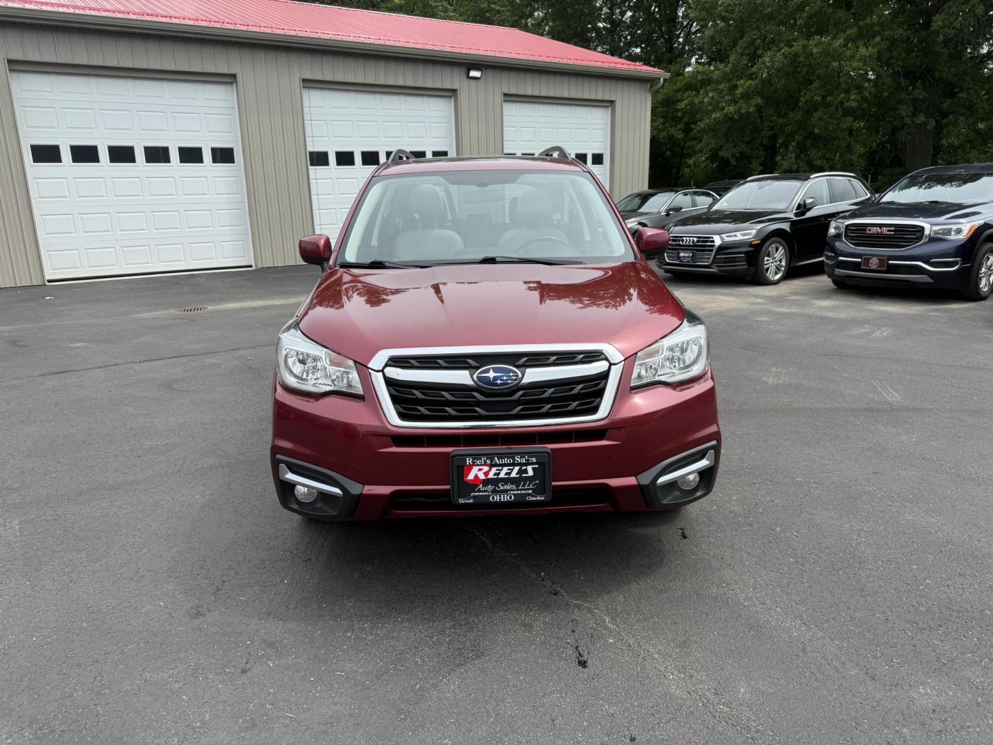 2018 Red /Gray Subaru Forester 2.5i Limited (JF2SJAJC5JH) with an 2.5L H4 DOHC 16V engine, Automatic transmission, located at 547 E. Main St., Orwell, OH, 44076, (440) 437-5893, 41.535435, -80.847855 - This 2018 Subaru Forester 2.5i Limited is a well-equipped compact SUV featuring a 2.5L H4 engine, leather interior, power driver's seat, heated front seats, and a 7.0" touchscreen infotainment system with a backup camera. It offers convenience and safety features like a power liftgate, blind spot mo - Photo#1