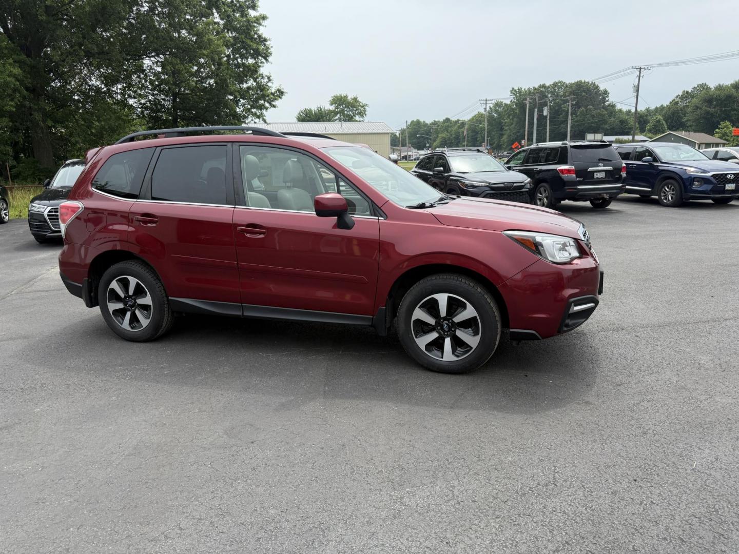 2018 Red /Gray Subaru Forester 2.5i Limited (JF2SJAJC5JH) with an 2.5L H4 DOHC 16V engine, Automatic transmission, located at 547 E. Main St., Orwell, OH, 44076, (440) 437-5893, 41.535435, -80.847855 - This 2018 Subaru Forester 2.5i Limited is a well-equipped compact SUV featuring a 2.5L H4 engine, leather interior, power driver's seat, heated front seats, and a 7.0" touchscreen infotainment system with a backup camera. It offers convenience and safety features like a power liftgate, blind spot mo - Photo#3