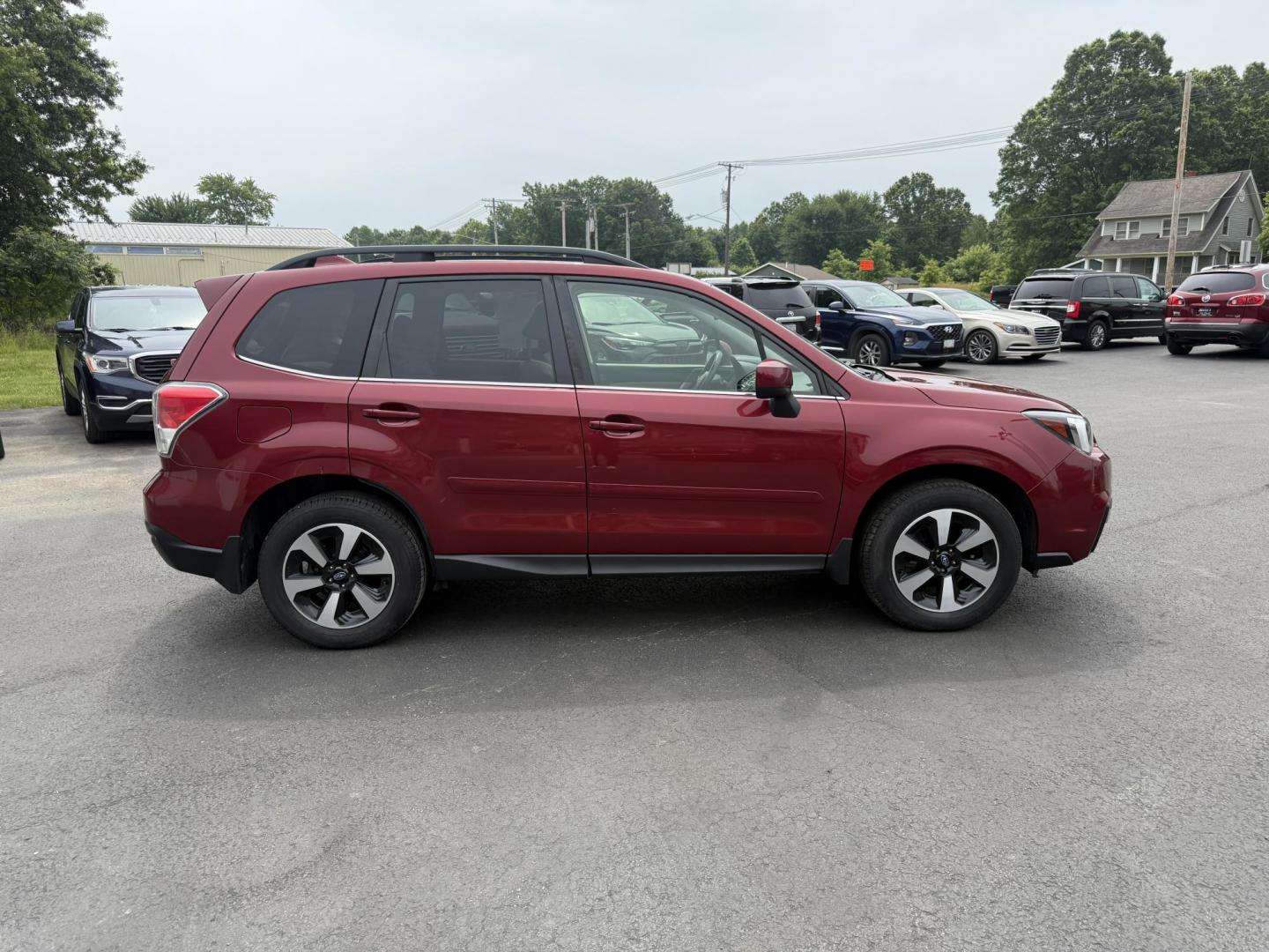 2018 Red /Gray Subaru Forester 2.5i Limited (JF2SJAJC5JH) with an 2.5L H4 DOHC 16V engine, Automatic transmission, located at 547 E. Main St., Orwell, OH, 44076, (440) 437-5893, 41.535435, -80.847855 - This 2018 Subaru Forester 2.5i Limited is a well-equipped compact SUV featuring a 2.5L H4 engine, leather interior, power driver's seat, heated front seats, and a 7.0" touchscreen infotainment system with a backup camera. It offers convenience and safety features like a power liftgate, blind spot mo - Photo#5