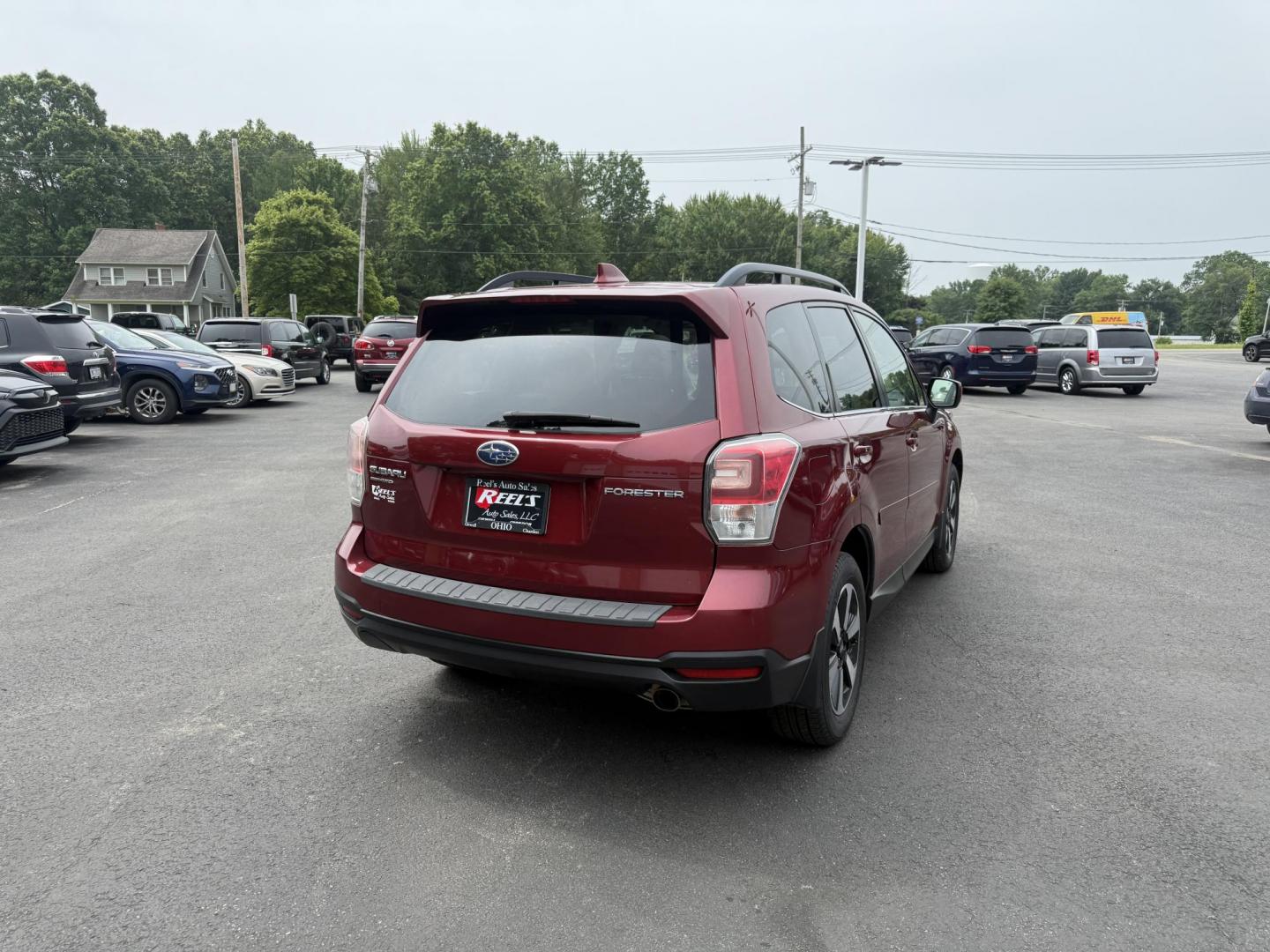 2018 Red /Gray Subaru Forester 2.5i Limited (JF2SJAJC5JH) with an 2.5L H4 DOHC 16V engine, Automatic transmission, located at 547 E. Main St., Orwell, OH, 44076, (440) 437-5893, 41.535435, -80.847855 - This 2018 Subaru Forester 2.5i Limited is a well-equipped compact SUV featuring a 2.5L H4 engine, leather interior, power driver's seat, heated front seats, and a 7.0" touchscreen infotainment system with a backup camera. It offers convenience and safety features like a power liftgate, blind spot mo - Photo#7