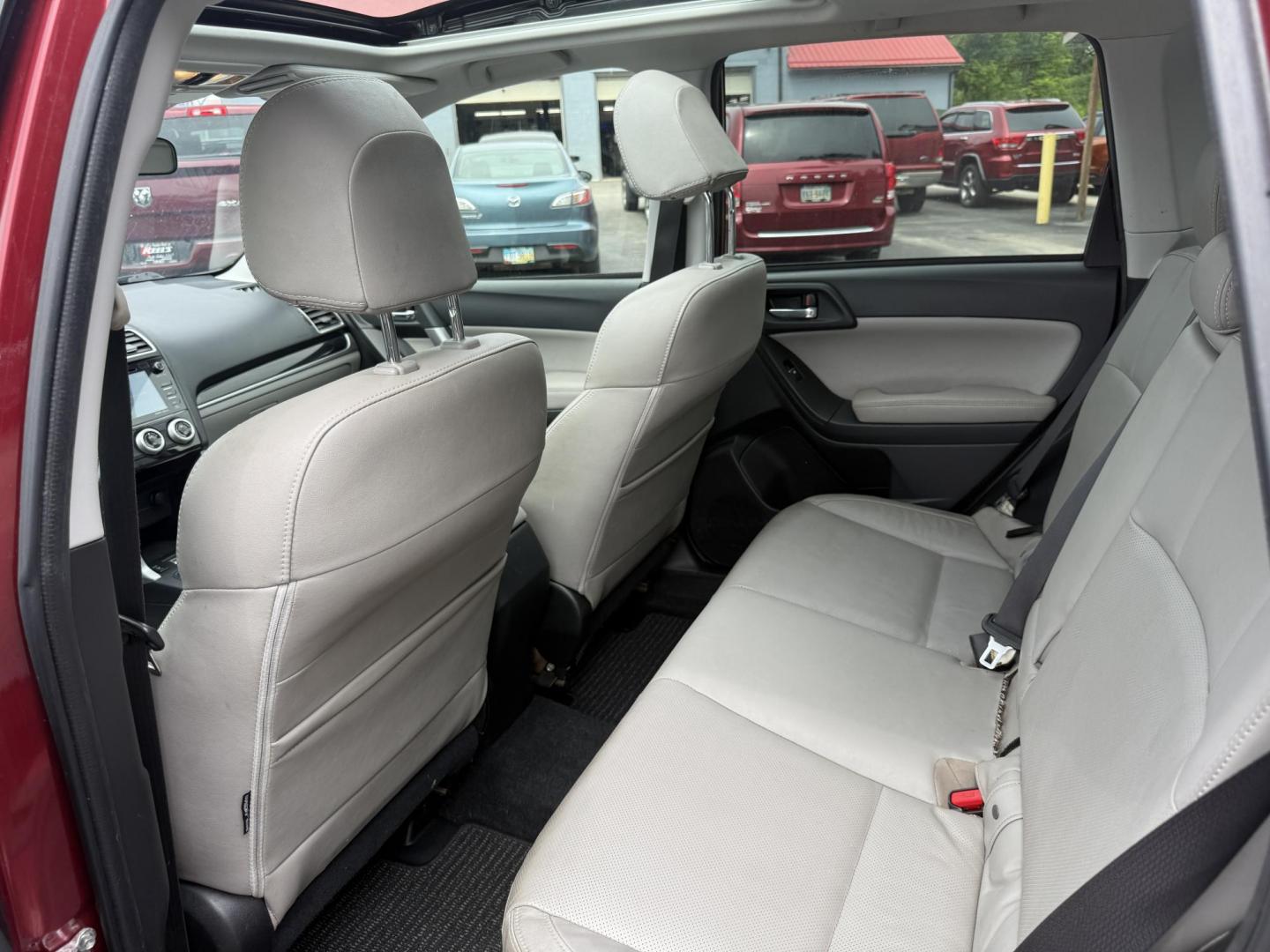 2018 Red /Gray Subaru Forester 2.5i Limited (JF2SJAJC5JH) with an 2.5L H4 DOHC 16V engine, Automatic transmission, located at 547 E. Main St., Orwell, OH, 44076, (440) 437-5893, 41.535435, -80.847855 - This 2018 Subaru Forester 2.5i Limited is a well-equipped compact SUV featuring a 2.5L H4 engine, leather interior, power driver's seat, heated front seats, and a 7.0" touchscreen infotainment system with a backup camera. It offers convenience and safety features like a power liftgate, blind spot mo - Photo#30