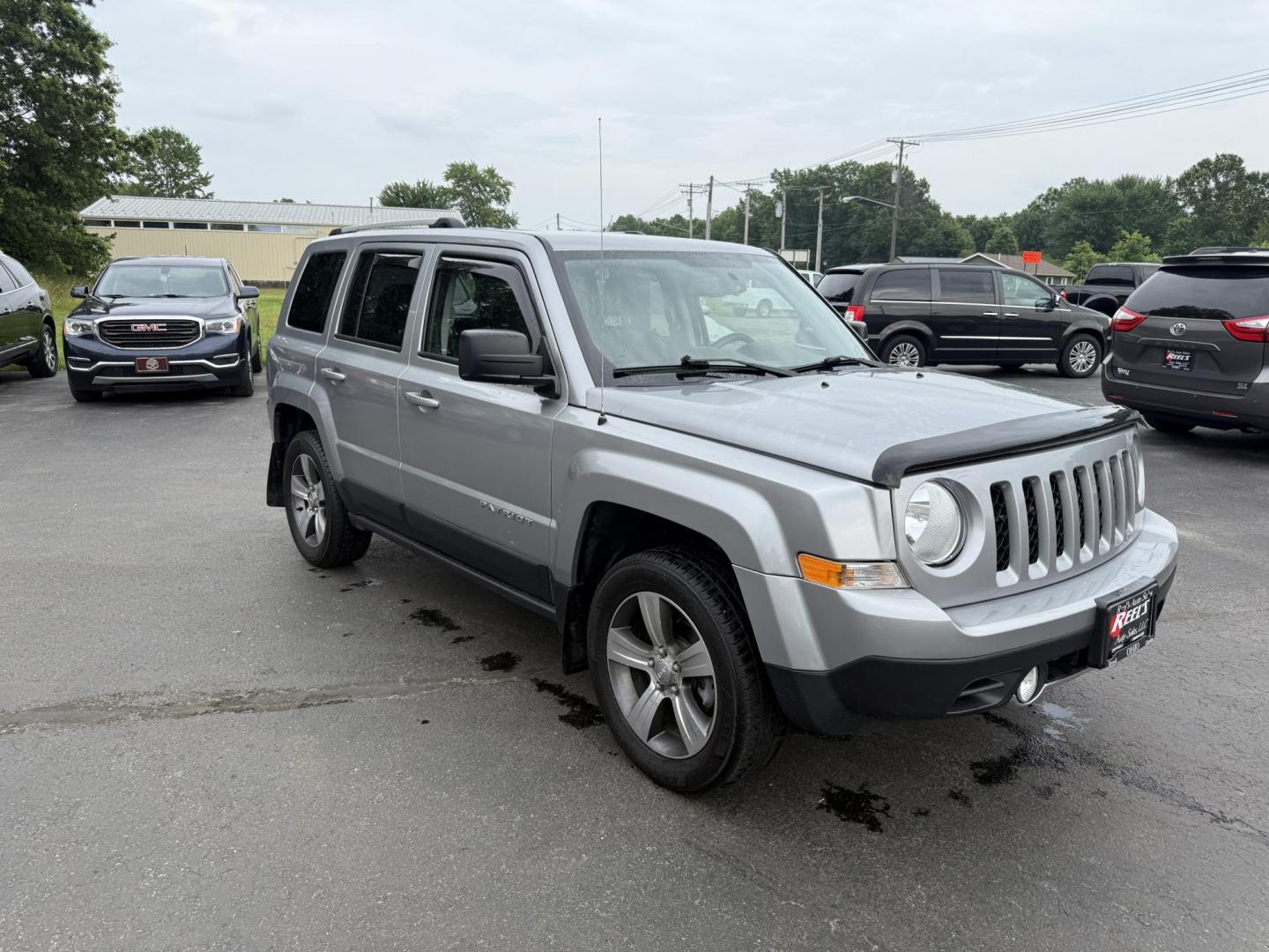 2017 Silver /Black Jeep Patriot High Altitude 4WD (1C4NJRFB3HD) with an 2.4L I4 DOHC 16V engine, 6 Speed Automatic transmission, located at 547 E. Main St., Orwell, OH, 44076, (440) 437-5893, 41.535435, -80.847855 - This 2017 Jeep Patriot High Altitude 4WD is a compact SUV featuring a 2.4L I4 engine paired with a 6-speed automatic transmission, offering capable all-wheel-drive performance. It boasts a leather interior, power driver's seat, heated front seats, remote start, and a 6.5" touchscreen with a backup c - Photo#2