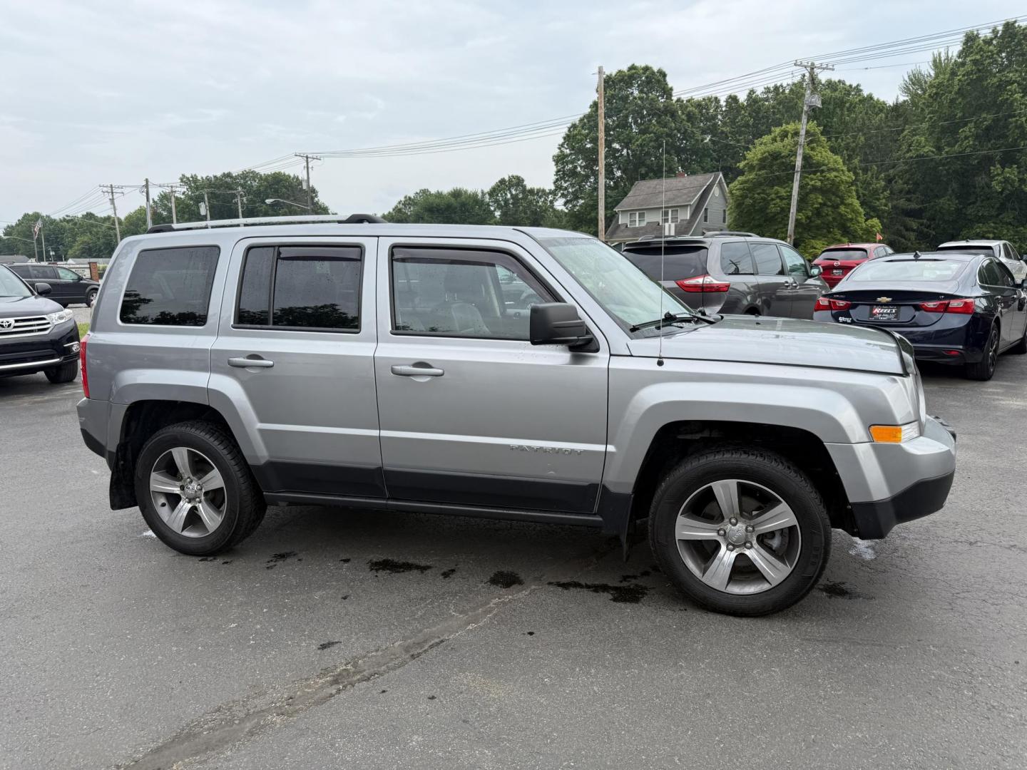 2017 Silver /Black Jeep Patriot High Altitude 4WD (1C4NJRFB3HD) with an 2.4L I4 DOHC 16V engine, 6 Speed Automatic transmission, located at 547 E. Main St., Orwell, OH, 44076, (440) 437-5893, 41.535435, -80.847855 - This 2017 Jeep Patriot High Altitude 4WD is a compact SUV featuring a 2.4L I4 engine paired with a 6-speed automatic transmission, offering capable all-wheel-drive performance. It boasts a leather interior, power driver's seat, heated front seats, remote start, and a 6.5" touchscreen with a backup c - Photo#3