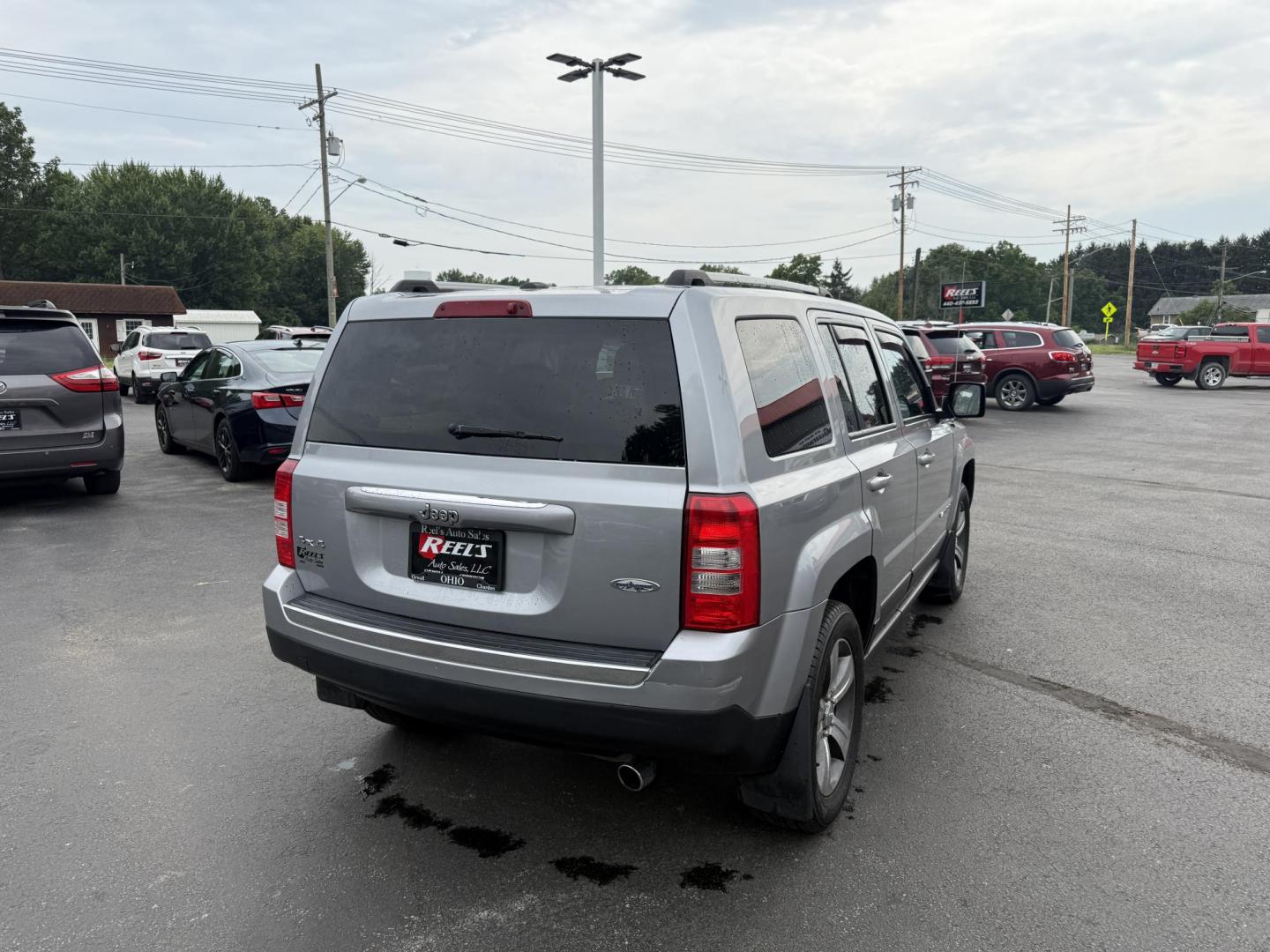 2017 Silver /Black Jeep Patriot High Altitude 4WD (1C4NJRFB3HD) with an 2.4L I4 DOHC 16V engine, 6 Speed Automatic transmission, located at 547 E. Main St., Orwell, OH, 44076, (440) 437-5893, 41.535435, -80.847855 - This 2017 Jeep Patriot High Altitude 4WD is a compact SUV featuring a 2.4L I4 engine paired with a 6-speed automatic transmission, offering capable all-wheel-drive performance. It boasts a leather interior, power driver's seat, heated front seats, remote start, and a 6.5" touchscreen with a backup c - Photo#7