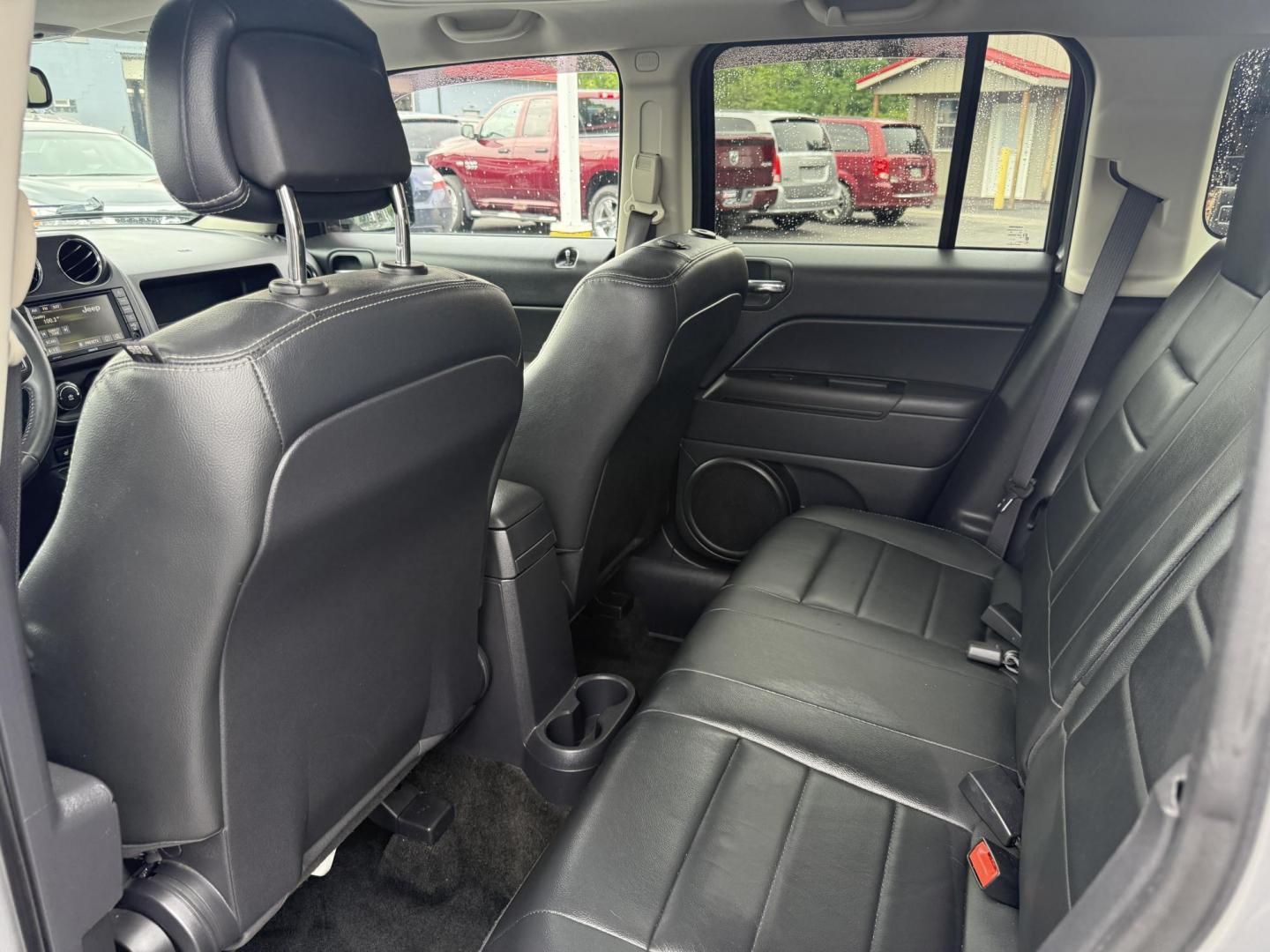 2017 Silver /Black Jeep Patriot High Altitude 4WD (1C4NJRFB3HD) with an 2.4L I4 DOHC 16V engine, 6 Speed Automatic transmission, located at 547 E. Main St., Orwell, OH, 44076, (440) 437-5893, 41.535435, -80.847855 - This 2017 Jeep Patriot High Altitude 4WD is a compact SUV featuring a 2.4L I4 engine paired with a 6-speed automatic transmission, offering capable all-wheel-drive performance. It boasts a leather interior, power driver's seat, heated front seats, remote start, and a 6.5" touchscreen with a backup c - Photo#29