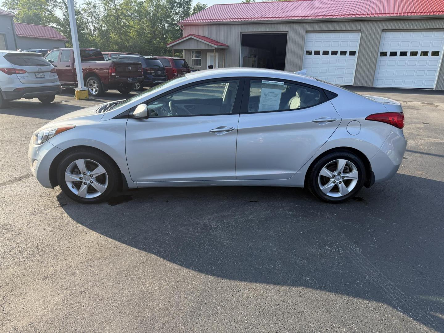 2013 Silver /Gray Hyundai Elantra GLS (5NPDH4AEXDH) with an 1.8L I4 DOHC 16V engine, 6-Speed Automatic transmission, located at 547 E. Main St., Orwell, OH, 44076, (440) 437-5893, 41.535435, -80.847855 - This One Owner Low Miles 2013 Hyundai Elantra GLS is a compact sedan powered by a 1.8L I4 GDI engine paired with a 6-speed automatic transmission, delivering an impressive 38 MPG on the highway. It features heated front seats and a USB audio input for added comfort and convenience, making it an econ - Photo#12