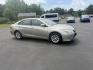 2015 Gold /Black Toyota Camry Hybrid LE (4T1BD1FK0FU) with an 2.5L I4 DOHC 16V HYBRID engine, Automatic transmission, located at 11115 Chardon Rd. , Chardon, OH, 44024, (440) 214-9705, 41.580246, -81.241943 - This 2015 Toyota Camry LE Hybrid is a fuel-efficient midsize sedan offering an impressive 40 MPG combined and a net power output of 200 horsepower. It features practical amenities like dusk-sensing headlights, dual-zone automatic climate control, an 8-way power driver’s seat, a 6.1-inch touchscree - Photo#3