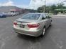 2015 Gold /Black Toyota Camry Hybrid LE (4T1BD1FK0FU) with an 2.5L I4 DOHC 16V HYBRID engine, Automatic transmission, located at 11115 Chardon Rd. , Chardon, OH, 44024, (440) 214-9705, 41.580246, -81.241943 - This 2015 Toyota Camry LE Hybrid is a fuel-efficient midsize sedan offering an impressive 40 MPG combined and a net power output of 200 horsepower. It features practical amenities like dusk-sensing headlights, dual-zone automatic climate control, an 8-way power driver’s seat, a 6.1-inch touchscree - Photo#7