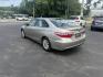 2015 Gold /Black Toyota Camry Hybrid LE (4T1BD1FK0FU) with an 2.5L I4 DOHC 16V HYBRID engine, Automatic transmission, located at 11115 Chardon Rd. , Chardon, OH, 44024, (440) 214-9705, 41.580246, -81.241943 - This 2015 Toyota Camry LE Hybrid is a fuel-efficient midsize sedan offering an impressive 40 MPG combined and a net power output of 200 horsepower. It features practical amenities like dusk-sensing headlights, dual-zone automatic climate control, an 8-way power driver’s seat, a 6.1-inch touchscree - Photo#9