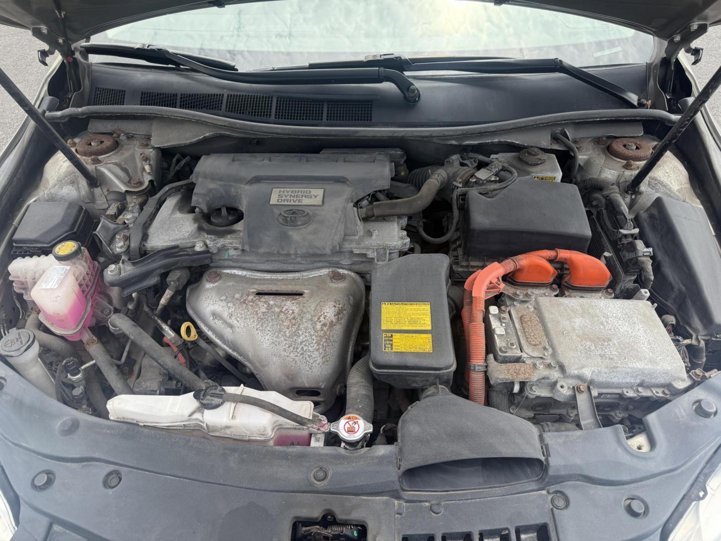 2015 Gold /Black Toyota Camry Hybrid LE (4T1BD1FK0FU) with an 2.5L I4 DOHC 16V HYBRID engine, Automatic transmission, located at 11115 Chardon Rd. , Chardon, OH, 44024, (440) 214-9705, 41.580246, -81.241943 - This 2015 Toyota Camry LE Hybrid is a fuel-efficient midsize sedan offering an impressive 40 MPG combined and a net power output of 200 horsepower. It features practical amenities like dusk-sensing headlights, dual-zone automatic climate control, an 8-way power driver’s seat, a 6.1-inch touchscree - Photo#14