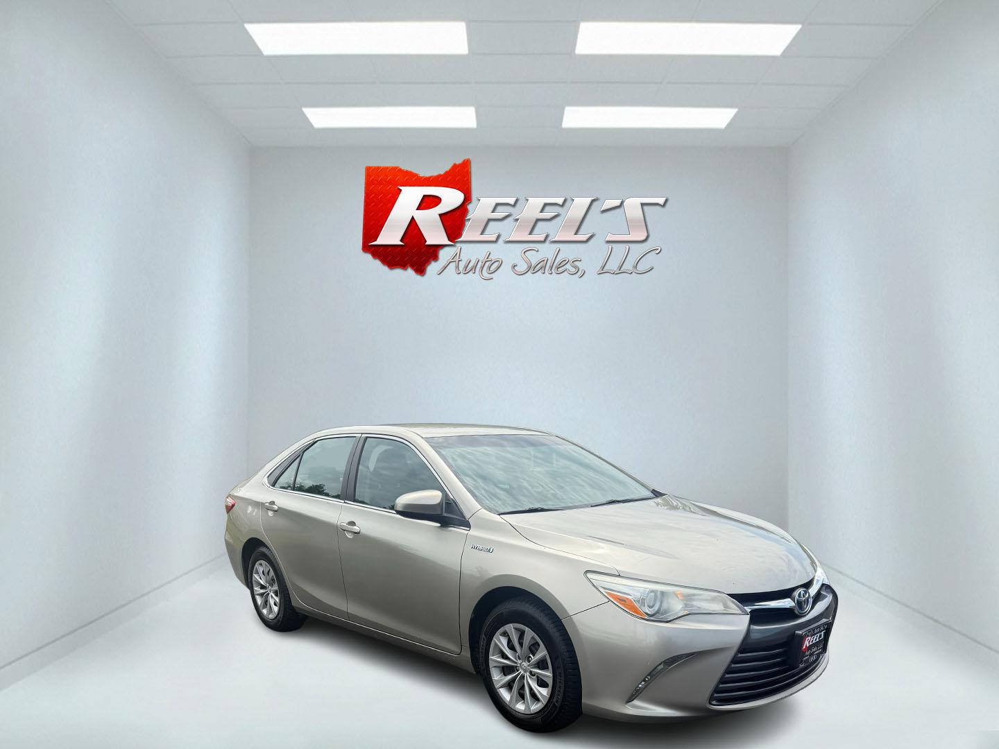 2015 Gold /Black Toyota Camry Hybrid LE (4T1BD1FK0FU) with an 2.5L I4 DOHC 16V HYBRID engine, Automatic transmission, located at 11115 Chardon Rd. , Chardon, OH, 44024, (440) 214-9705, 41.580246, -81.241943 - This 2015 Toyota Camry LE Hybrid is a fuel-efficient midsize sedan offering an impressive 40 MPG combined and a net power output of 200 horsepower. It features practical amenities like dusk-sensing headlights, dual-zone automatic climate control, an 8-way power driver’s seat, a 6.1-inch touchscree - Photo#2
